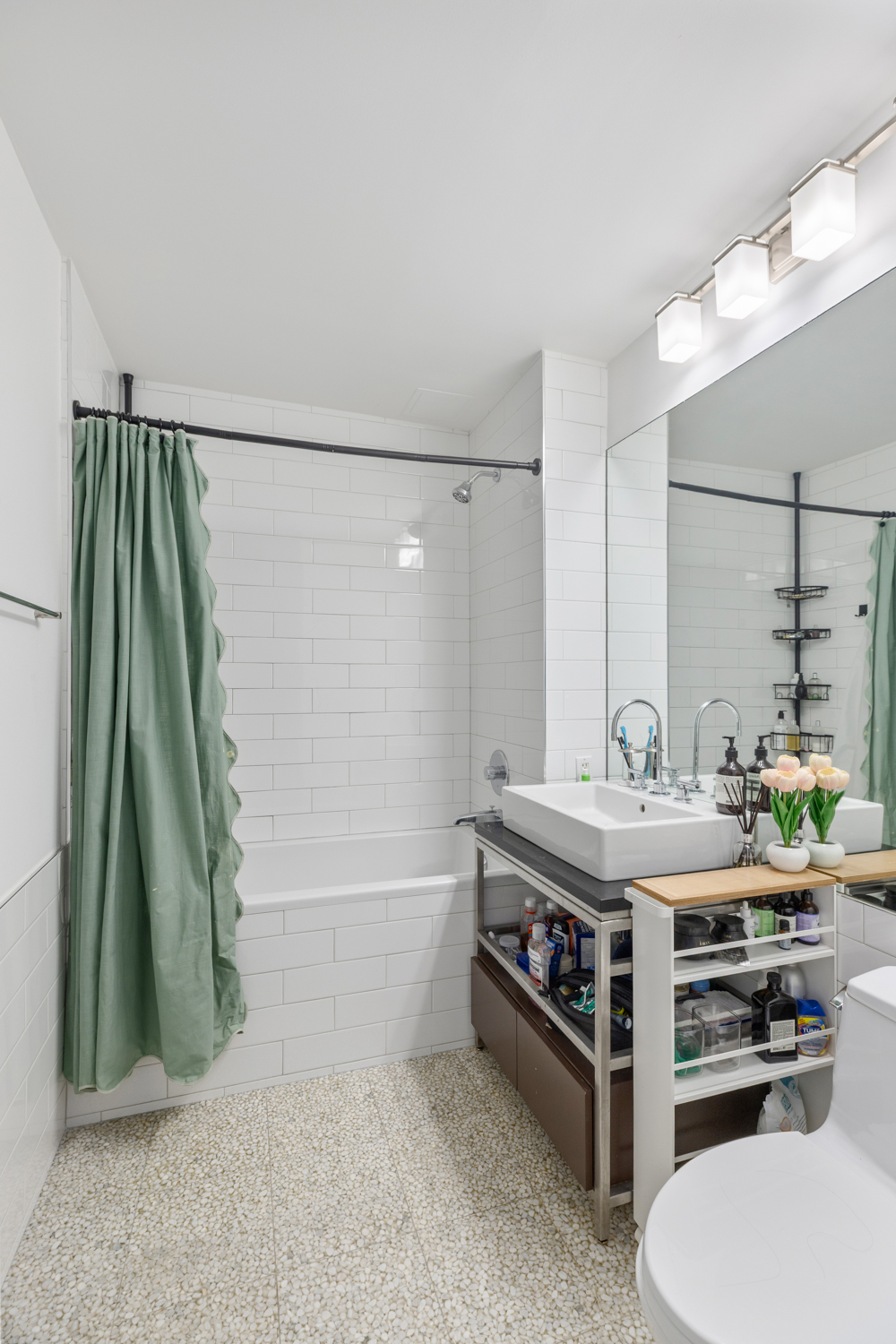 105 Norfolk Street, Unit 2A Manhattan, NY 10002 - Photo 7 of 16 a bathroom with a double vanity sink and a bathtub