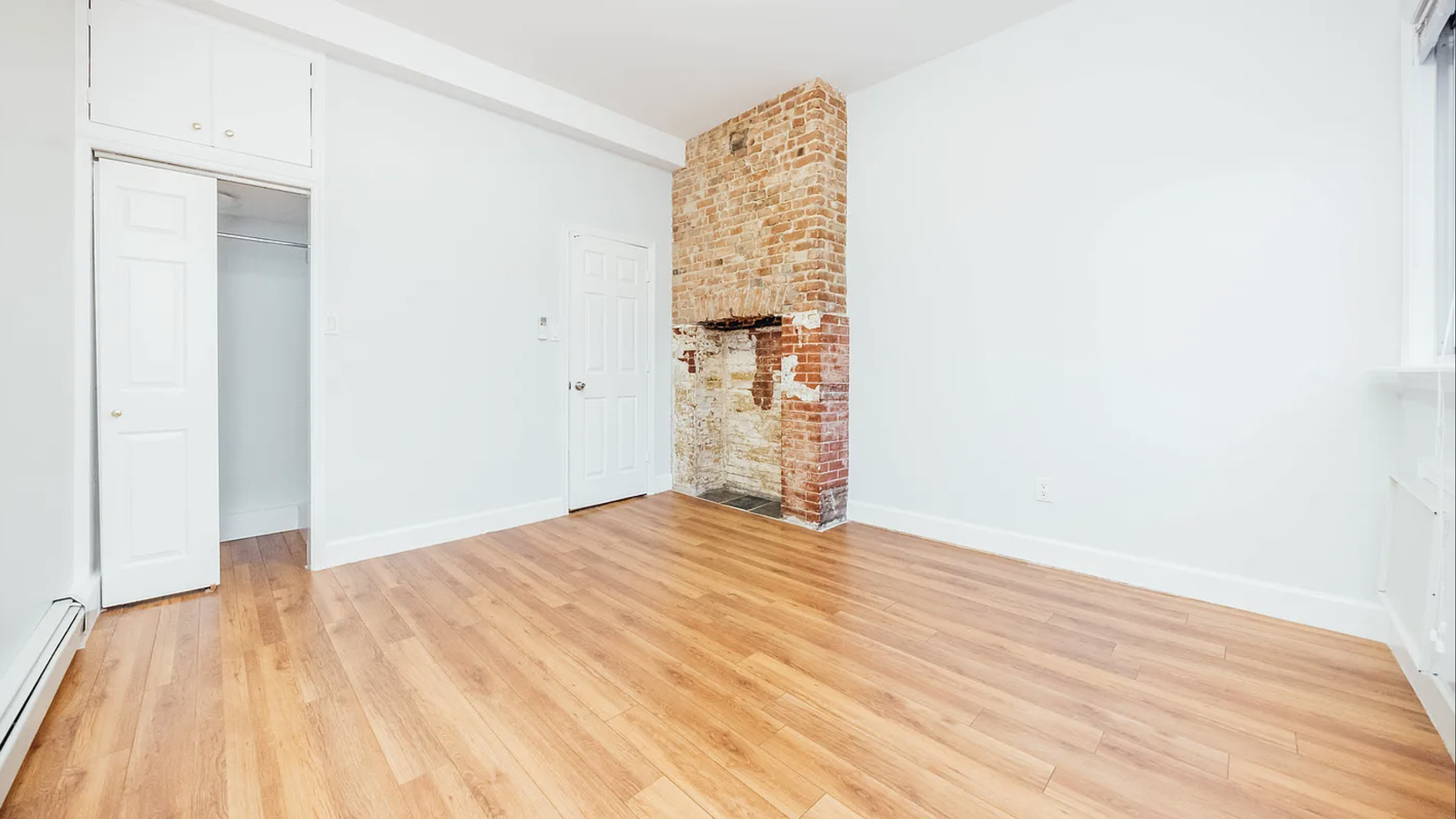 132 Jefferson Street, Unit 3L Brooklyn, NY 11206 - Photo 6 of 12 a view of empty room with wooden floor