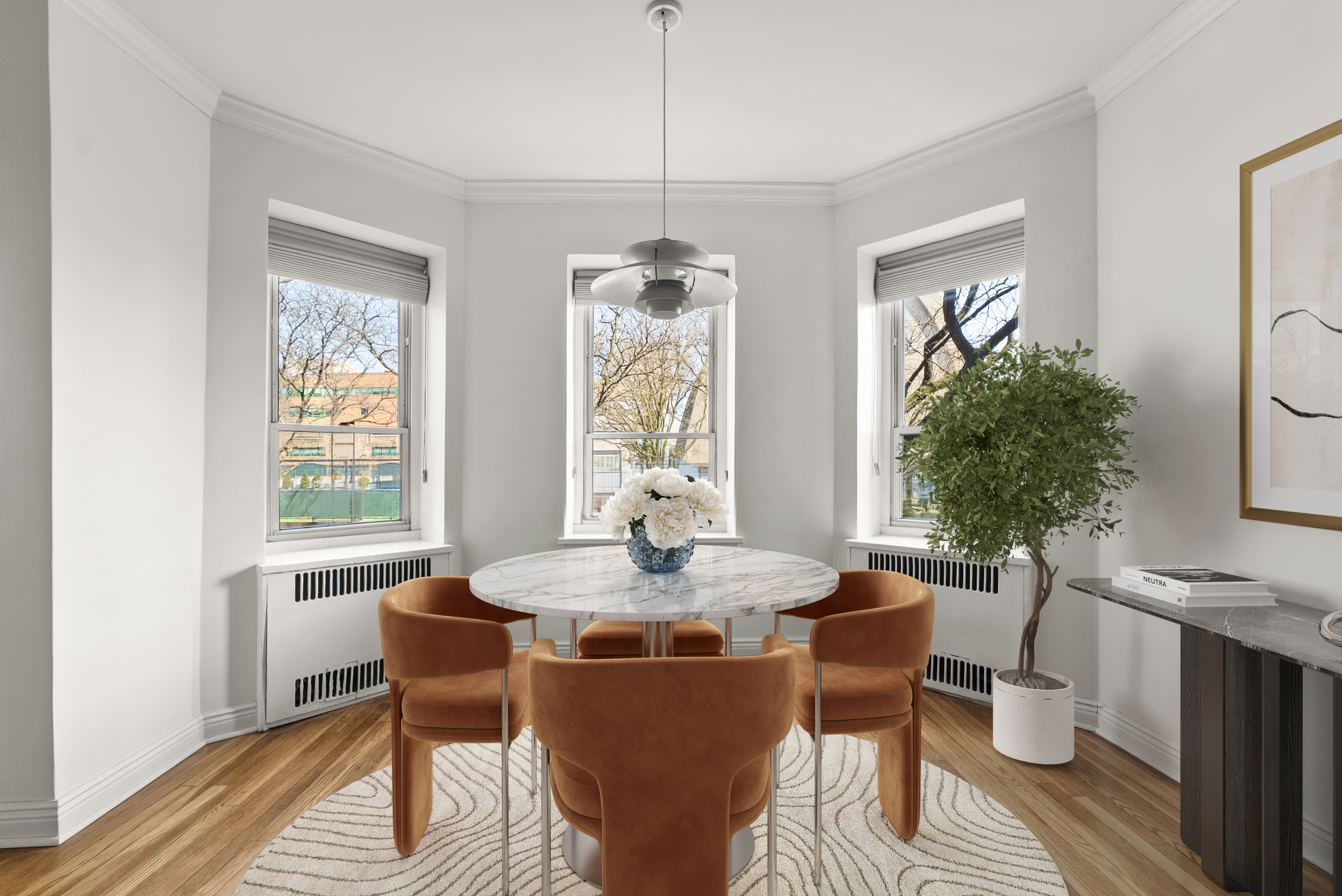 530 East 90th Street, Unit 2M Manhattan, NY 10128 - Photo 2 of 12 a dining room with furniture window wooden floor