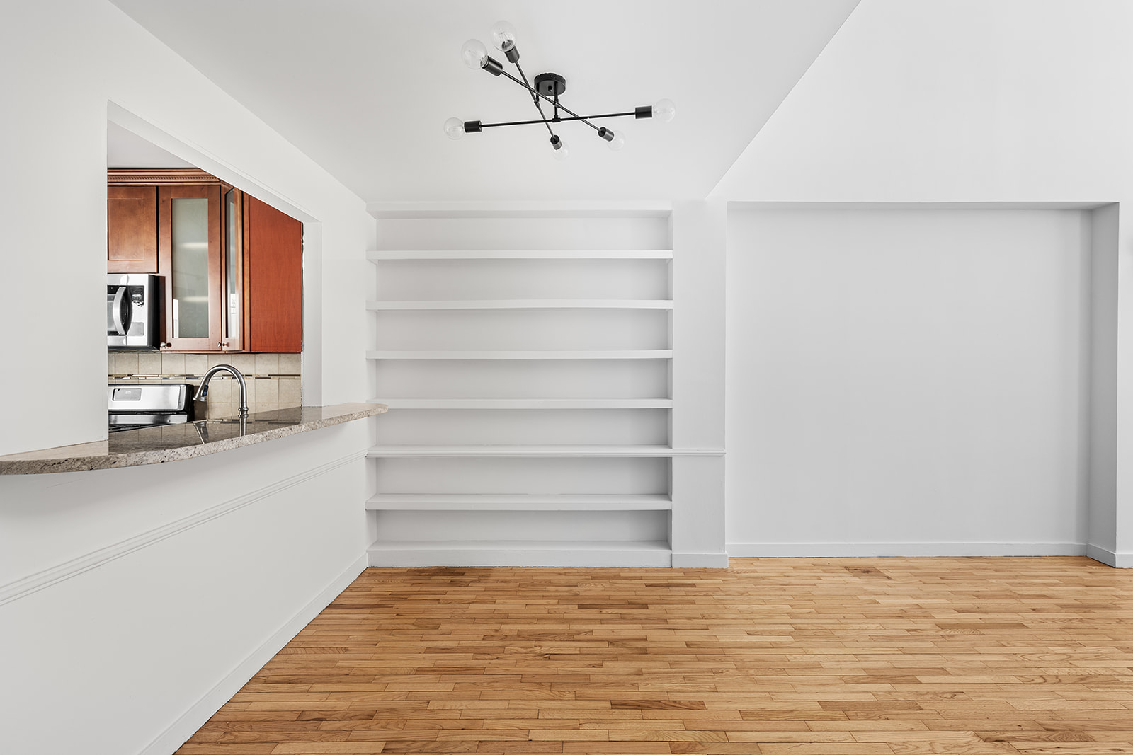 126 Waverly Place, Unit 2F Manhattan, NY 10011 - Photo 2 of 11 a view of a room with a sink and a ceiling fan