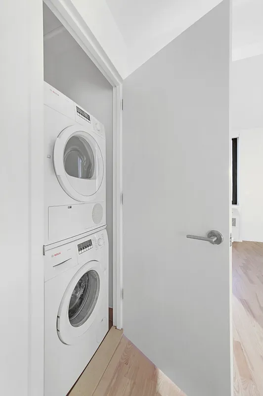 626 Flatbush Avenue, Unit 7E Brooklyn, NY 11225 - Photo 7 of 23 a utility room with dryer and washer