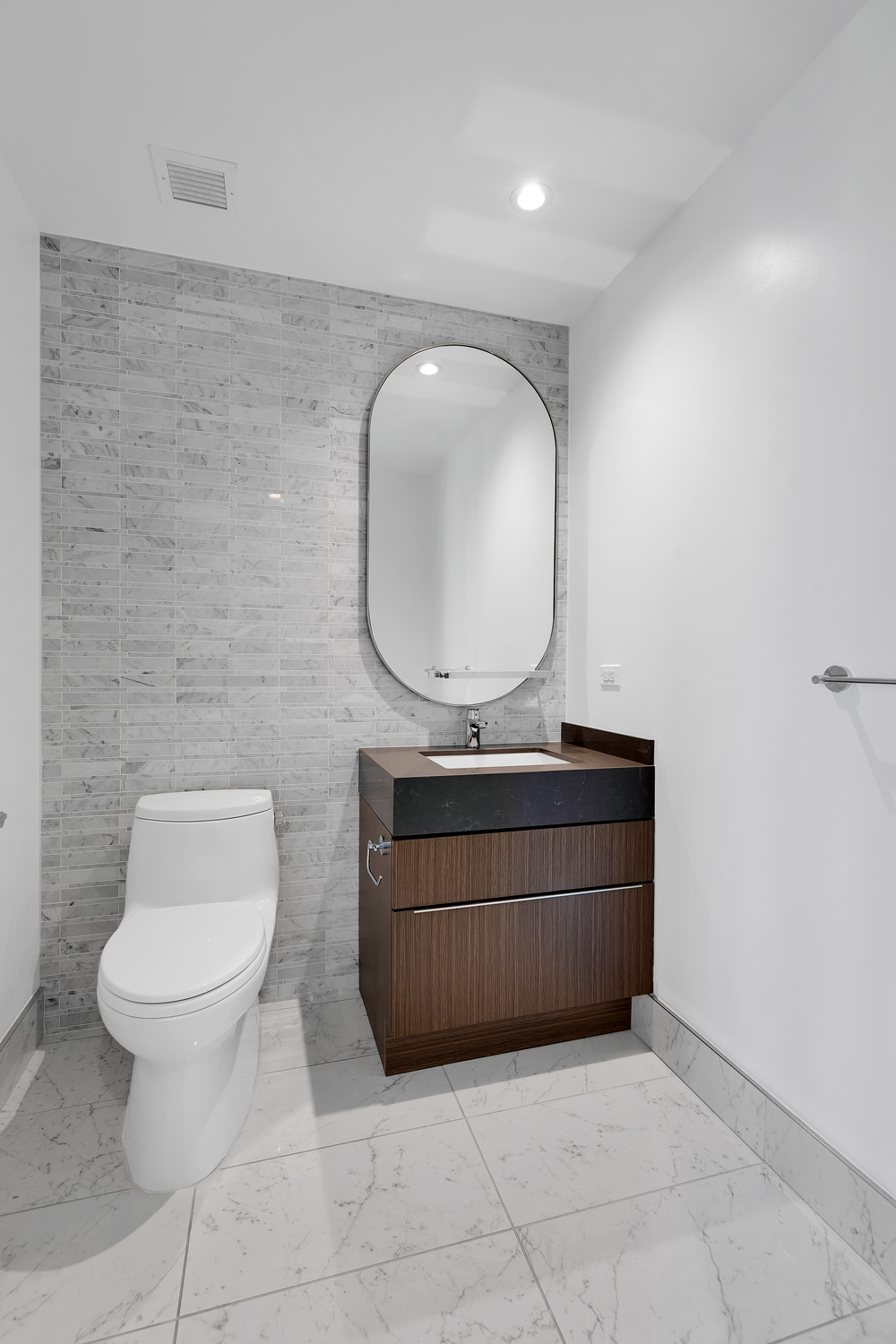30 Riverside Boulevard, Unit 1414 Manhattan, NY 10069 - Photo 10 of 25 a living room with a toilet sink and mirror