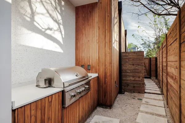 a living room with furniture and potted plant