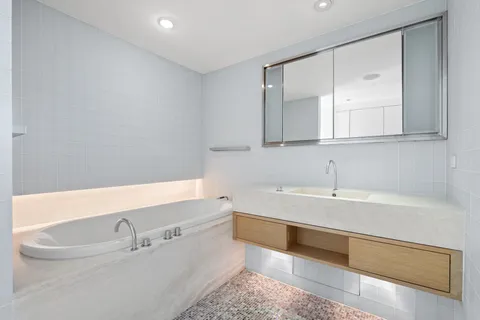 a bathroom with a bathtub and a sink