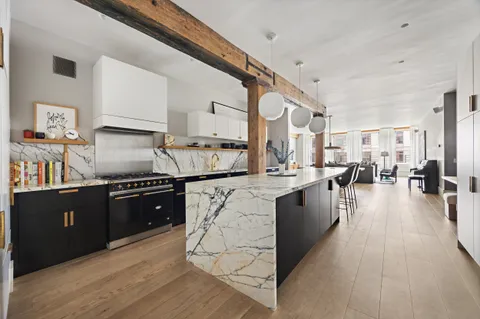 a large kitchen with granite countertop lots of counter top space