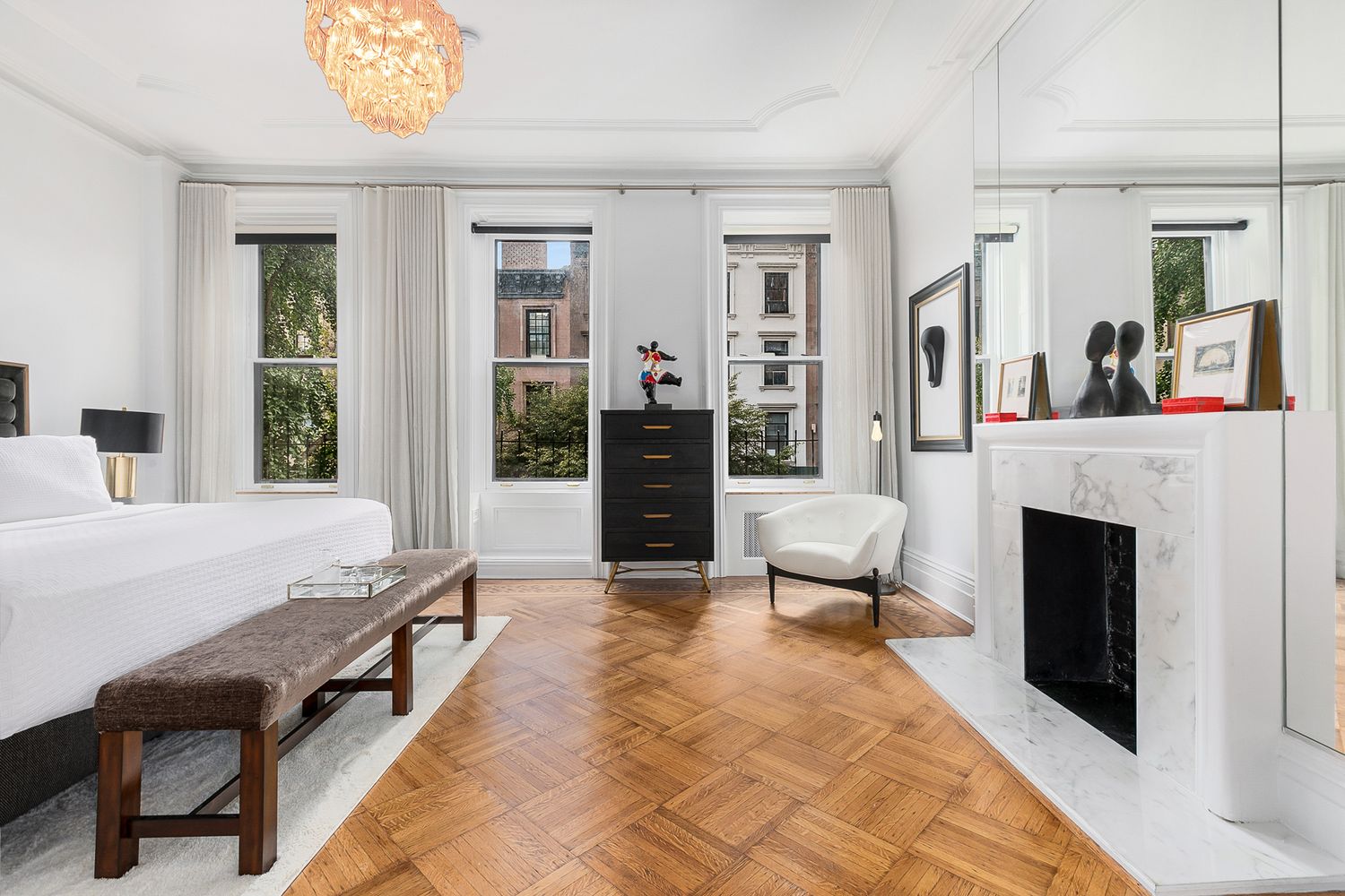 209 East 61st Street Manhattan, NY 10065 - Photo 11 of 27 a living room with furniture and a fireplace