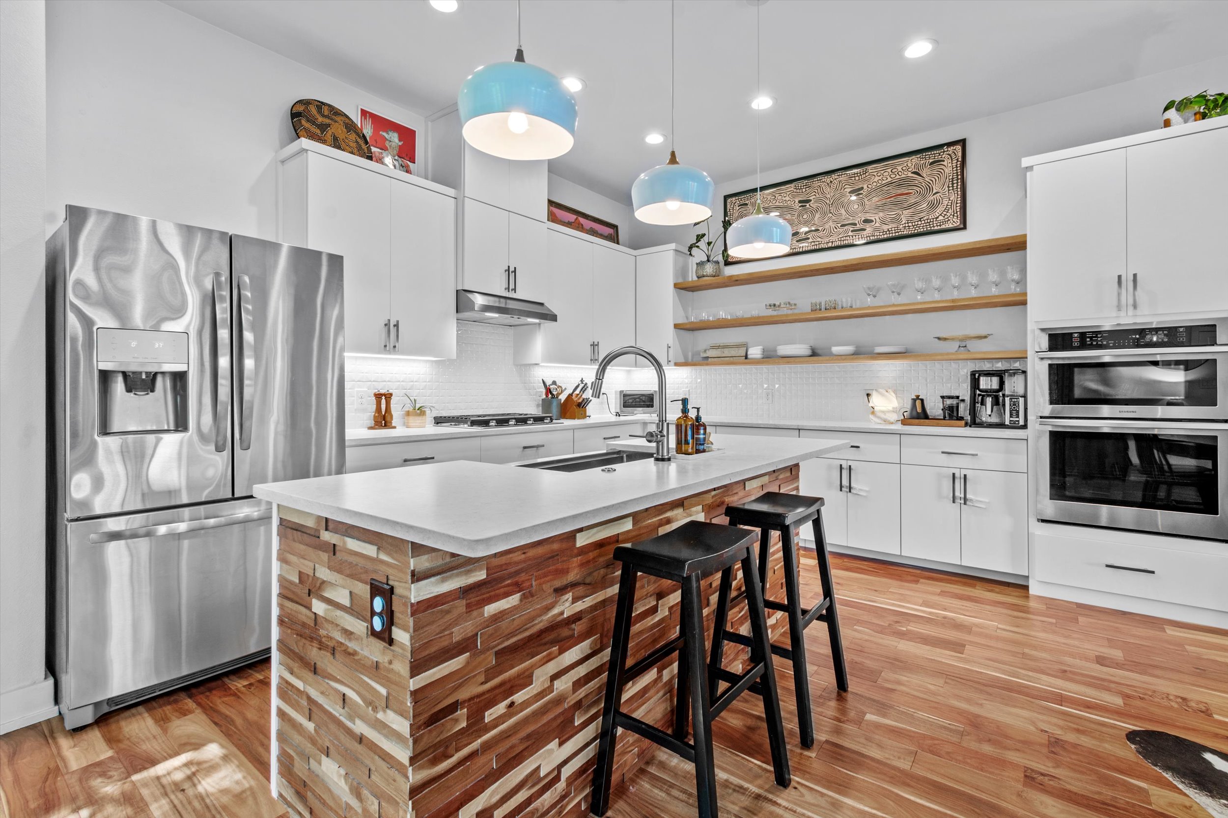 2712 Oak Springs Drive, Unit A Austin, TX 78702 - Photo 21 of 38 a kitchen with stainless steel appliances granite countertop a refrigerator and a stove top oven