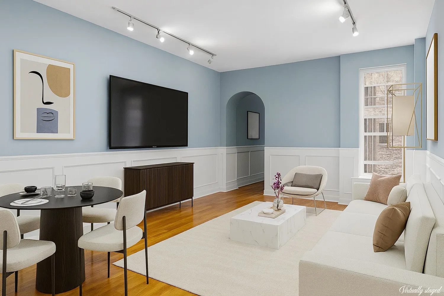 a living room with furniture and a flat screen tv