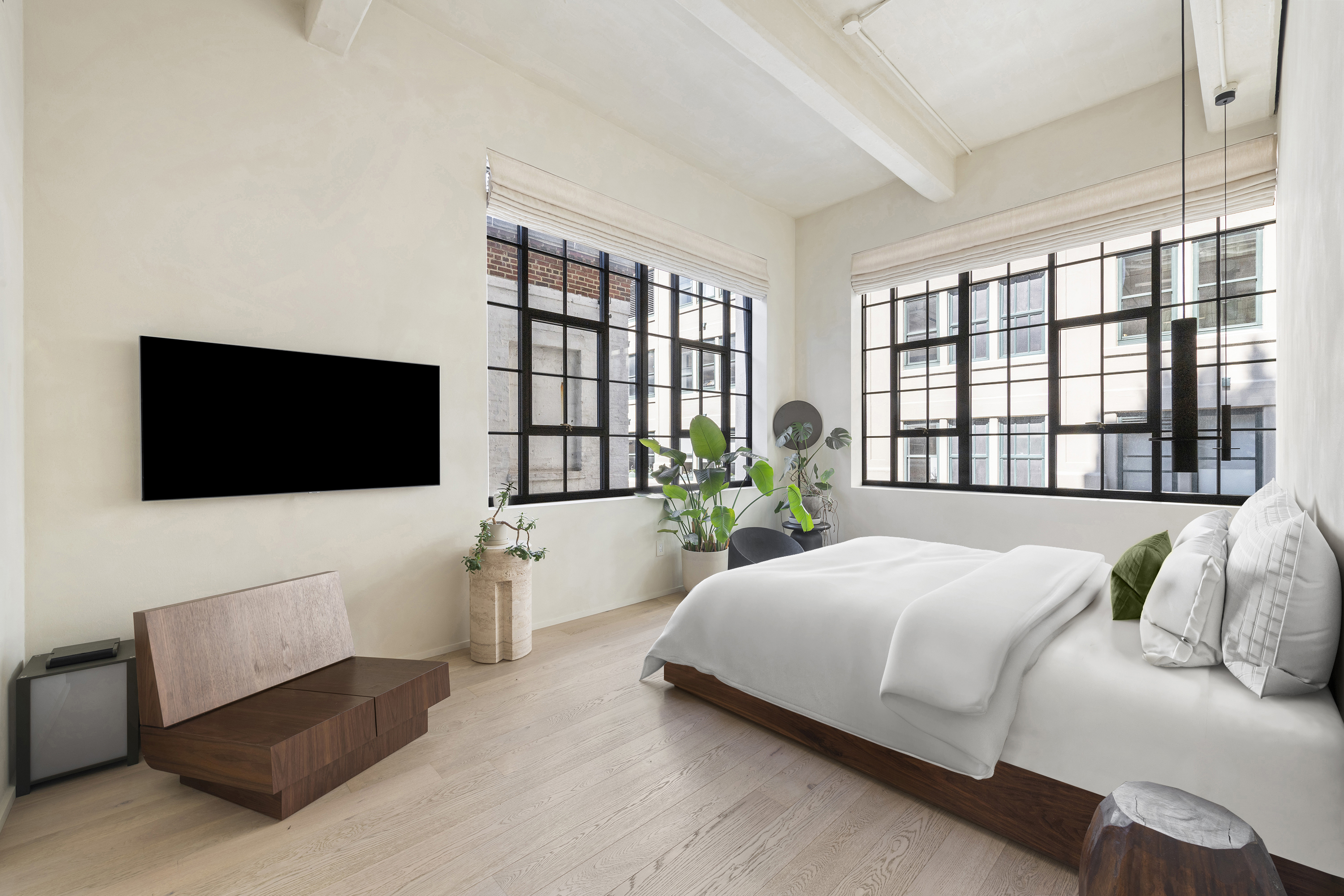 168 Plymouth Street, Unit 5A Brooklyn, NY 11201 - Photo 8 of 19 a bedroom with a bed a couch and a flat screen tv