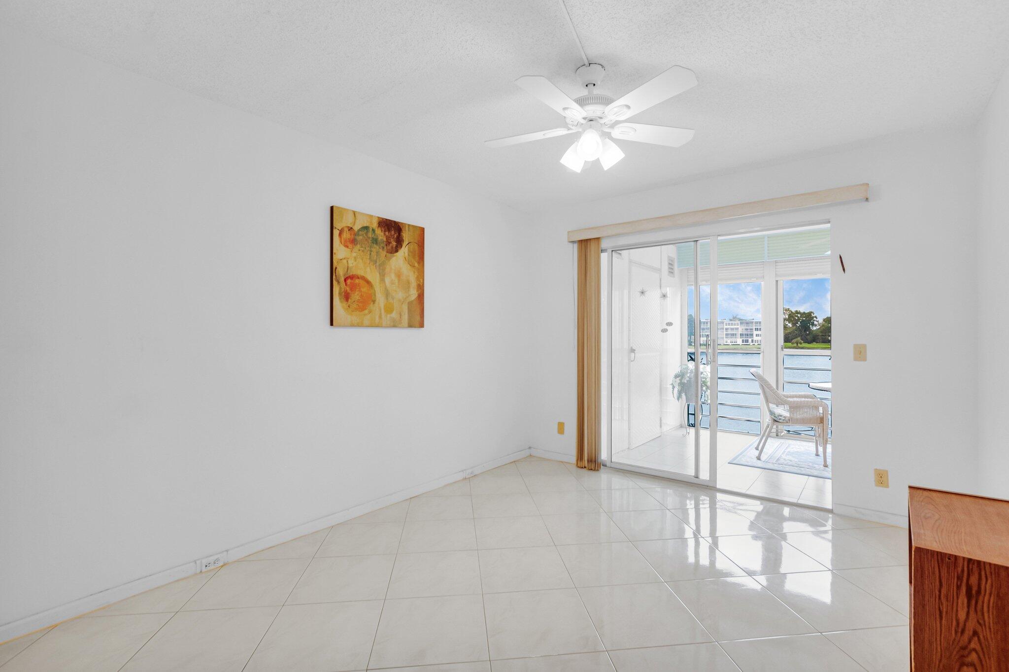 2035 Ainslie C Boca Raton, FL 33434 - Photo 8 of 17 a view of an empty room with a window