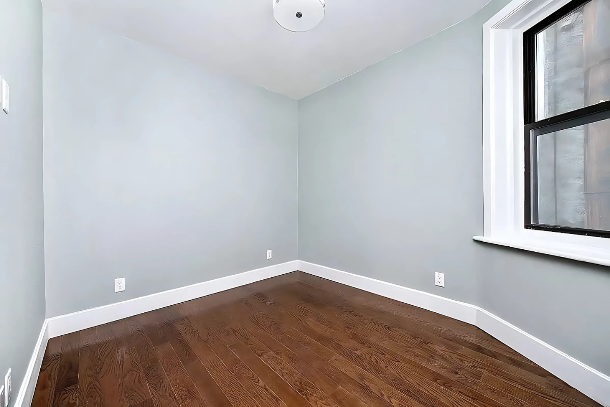 201 West 80th Street, Unit 4W Manhattan, NY 10024 - Photo 5 of 11 a view of a room with wooden floor and windows