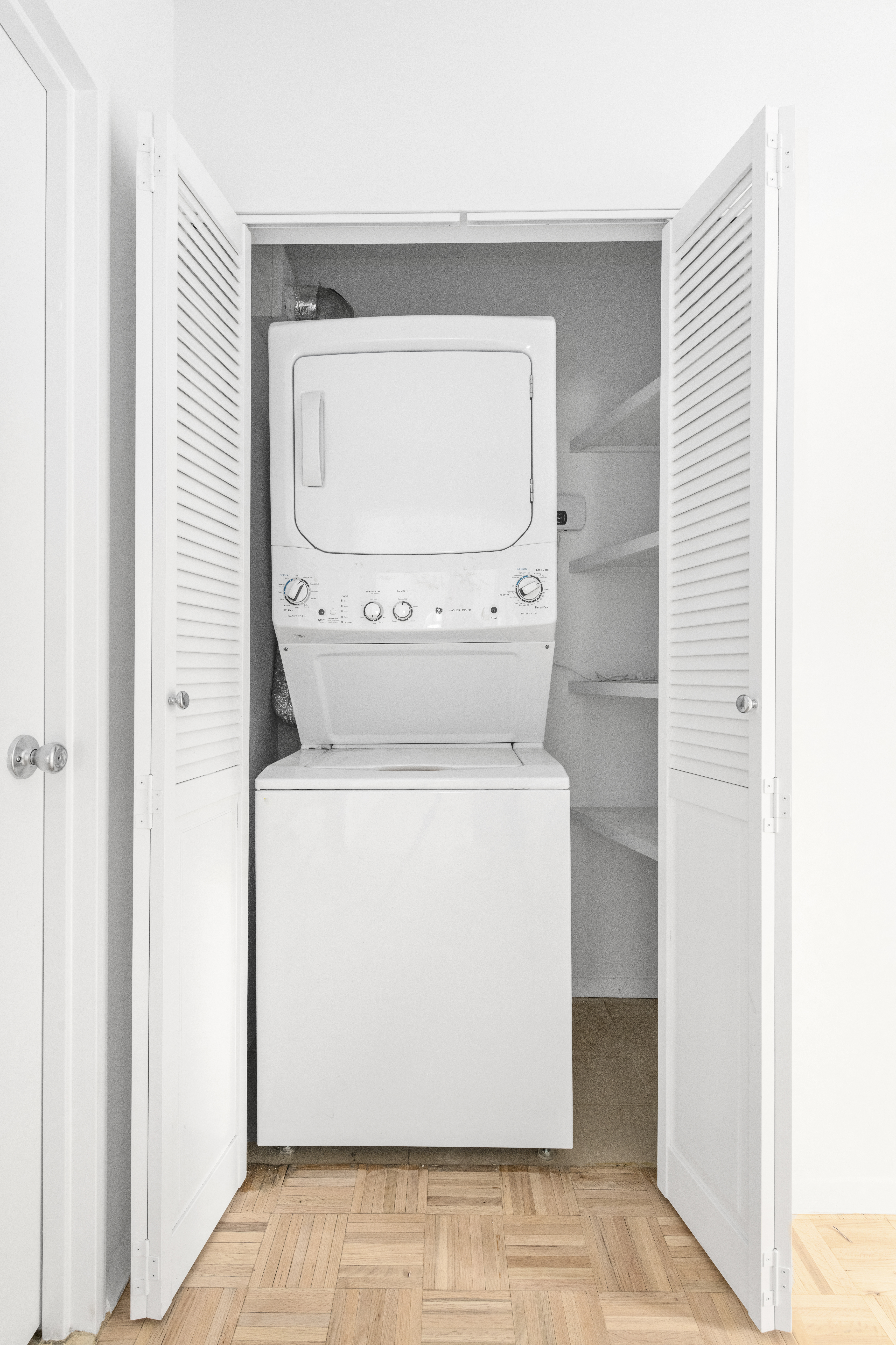 100 West 89th Street, Unit 3E Manhattan, NY 10024 - Photo 8 of 19 a utility room with dryer and washer