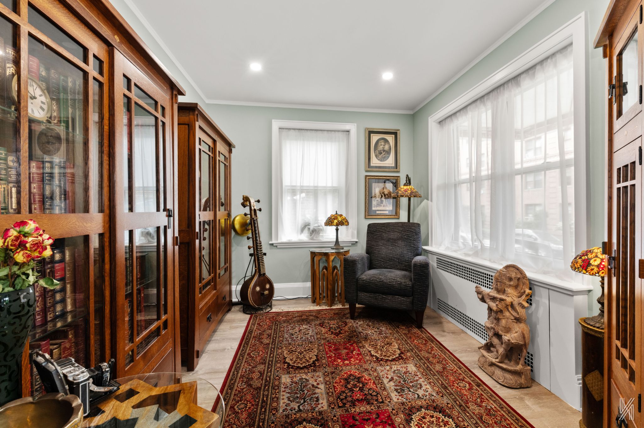 34-41 85th Street, Unit 1X Queens, NY 11372 - Photo 6 of 24 a living room with furniture and a window