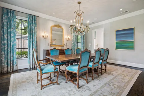 a view of a dining room with furniture and window