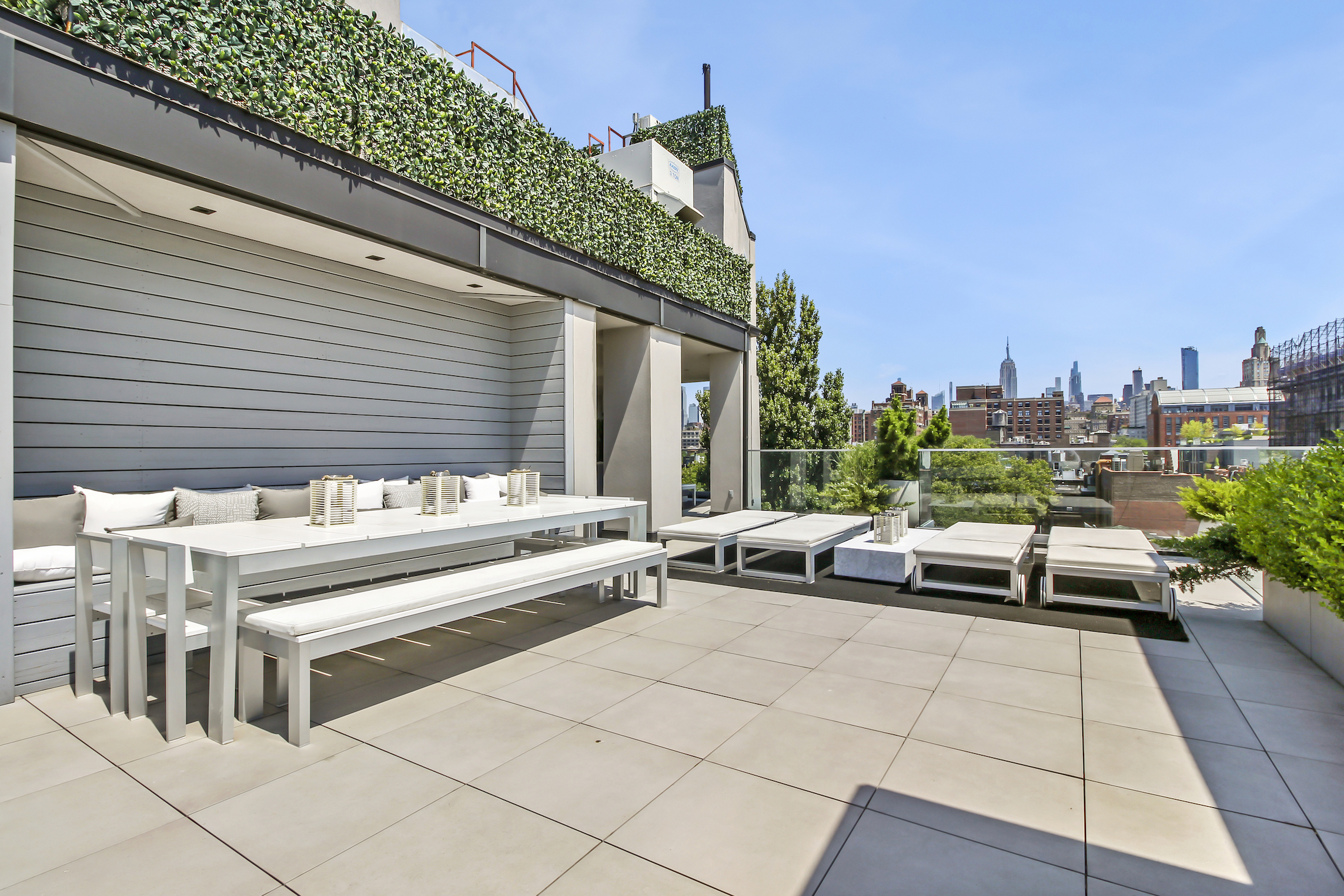 136 West Houston Street, Unit PH Manhattan, NY 10012 - Photo 7 of 26 a view of a patio with couches table and chairs and potted plants