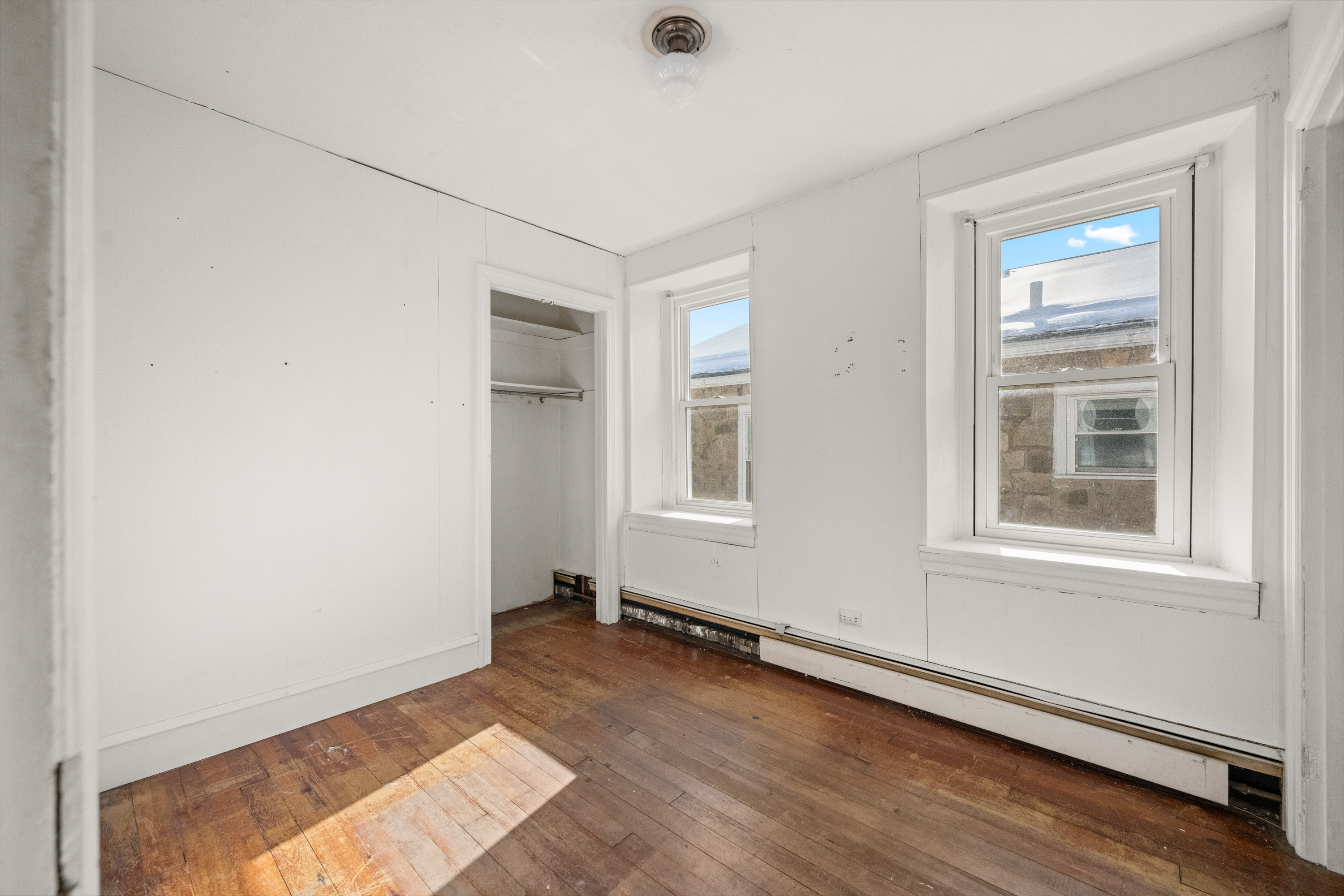 458 Renfrew Avenue Ambler, PA 19002 - Photo 21 of 32 an empty room with wooden floor and windows