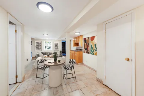 a living room with patio furniture and a window