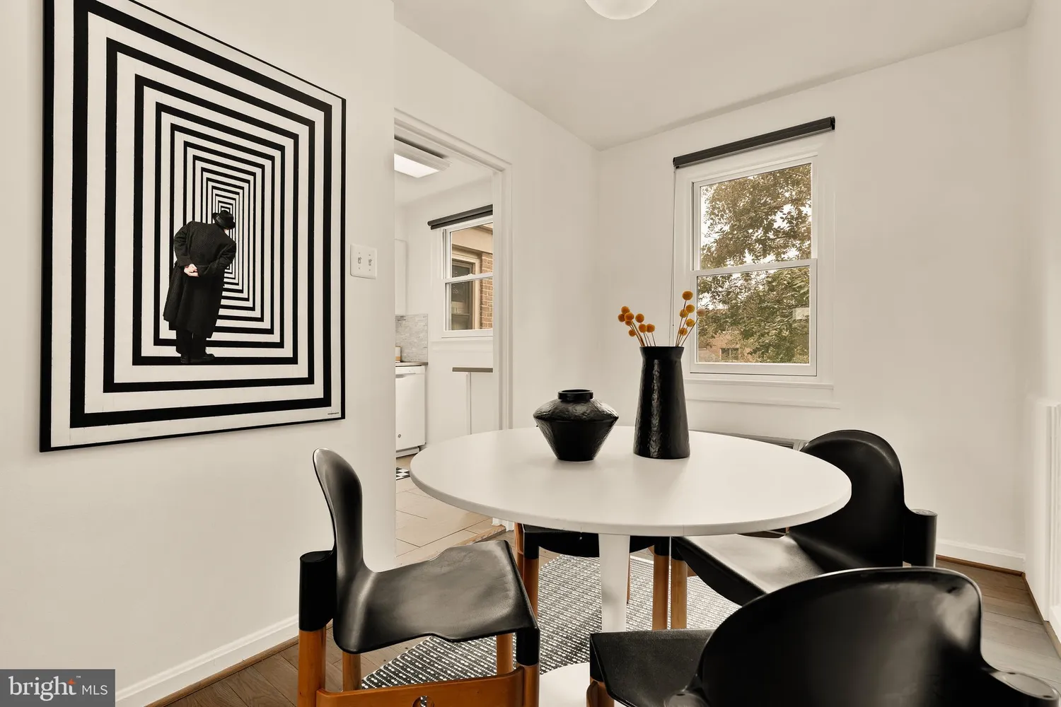 a view of a dining room with furniture and window