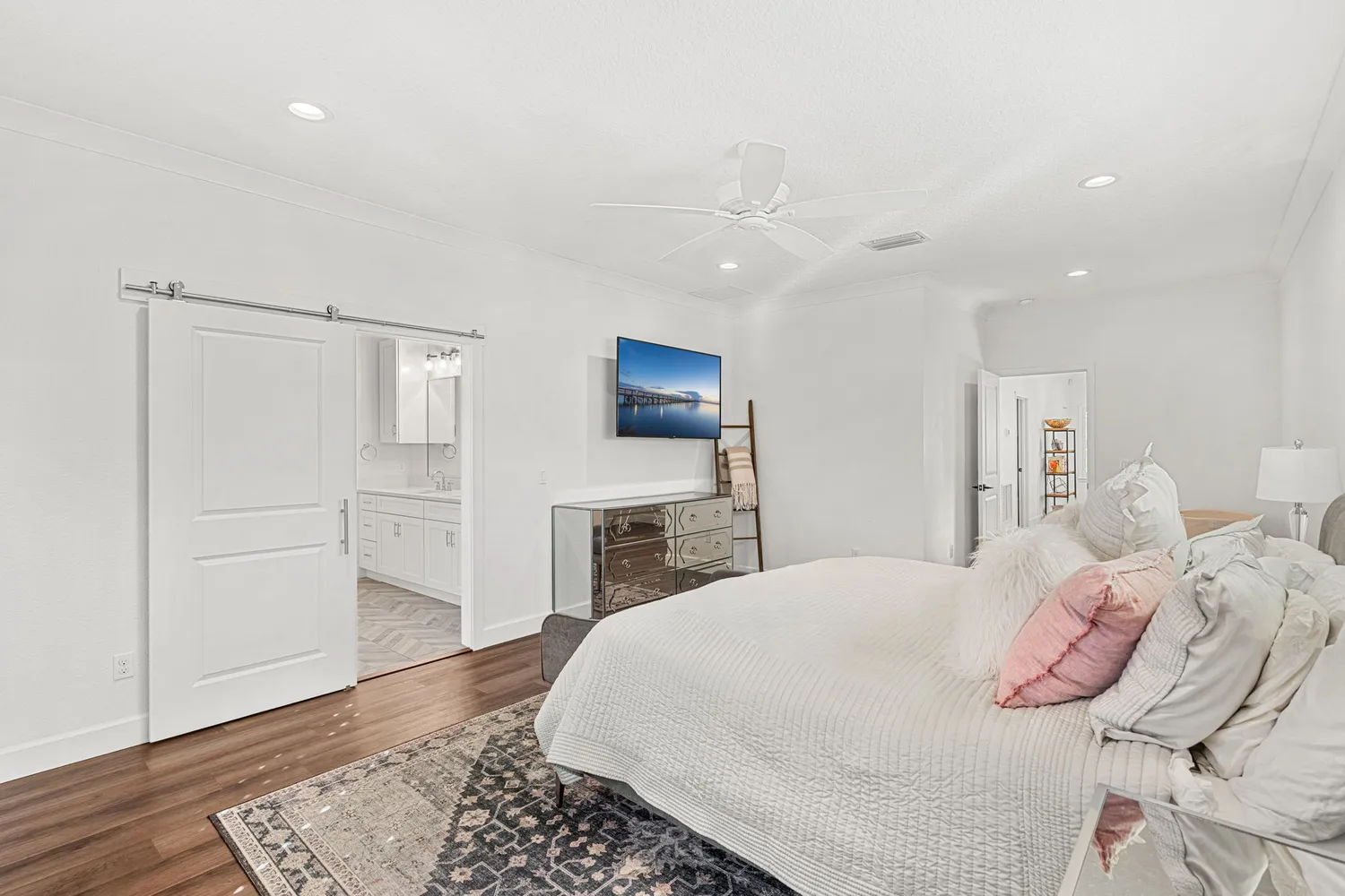 a bedroom with a bed and a dresser