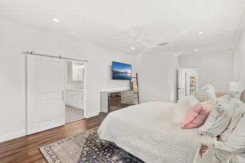 a bedroom with a bed and a dresser