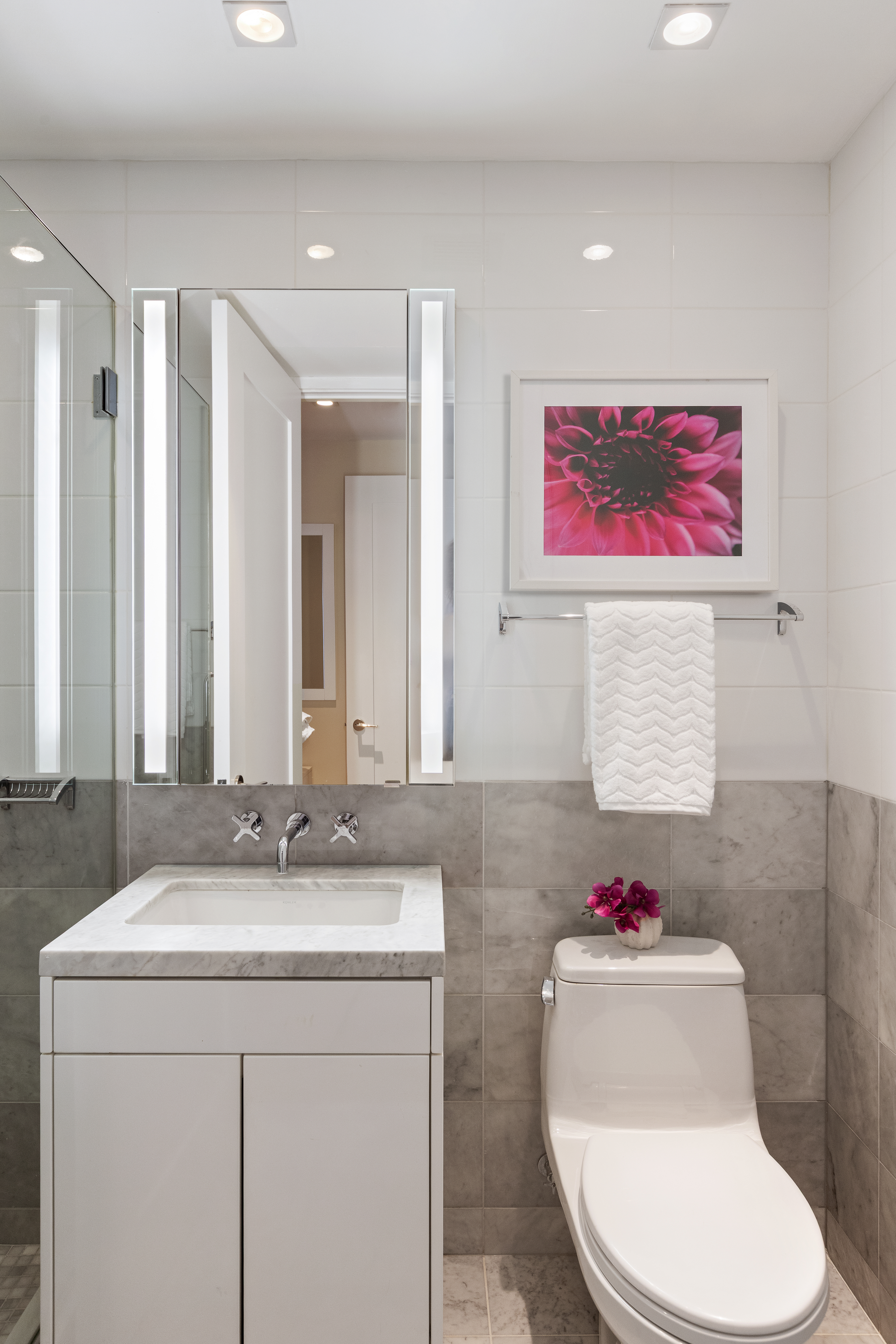 1355 1st Avenue, Unit 8 Manhattan, NY 10021 - Photo 19 of 25 a bathroom with a sink and a mirror