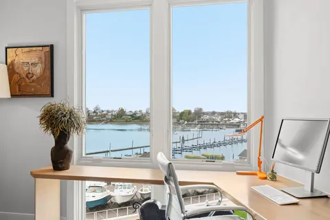 a view of a floor to ceiling window and a living room