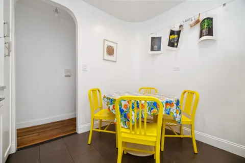 a dining room with a table and a chairs
