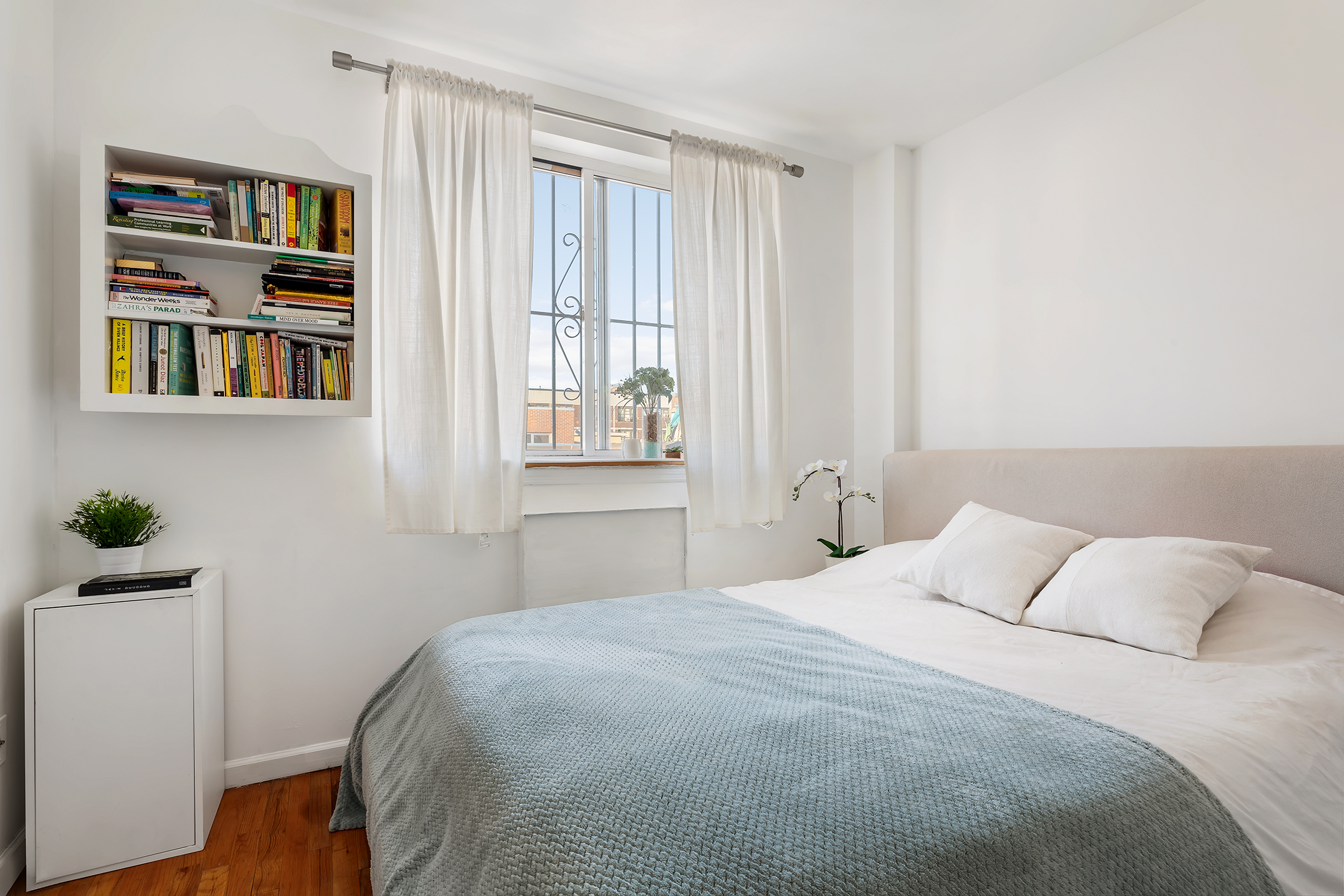 97 Moore Street, Unit 4B Brooklyn, NY 11206 - Photo 4 of 8 a bedroom with a bed and a window
