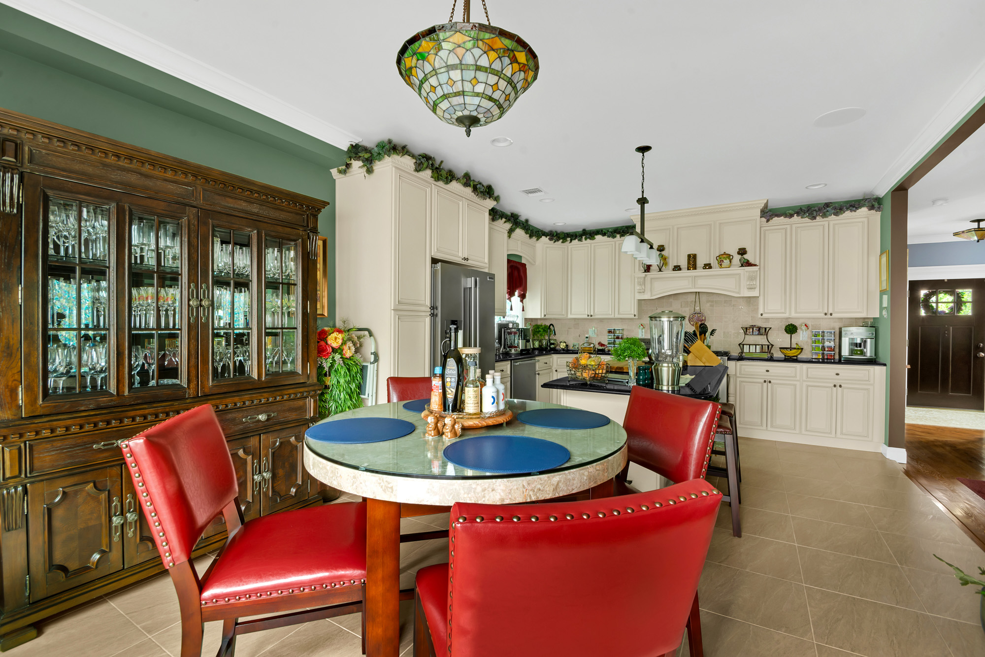 909 Jewett Avenue Staten Island, NY 10314 - Photo 14 of 65 a view of a dining room with furniture a chandelier and wooden floor