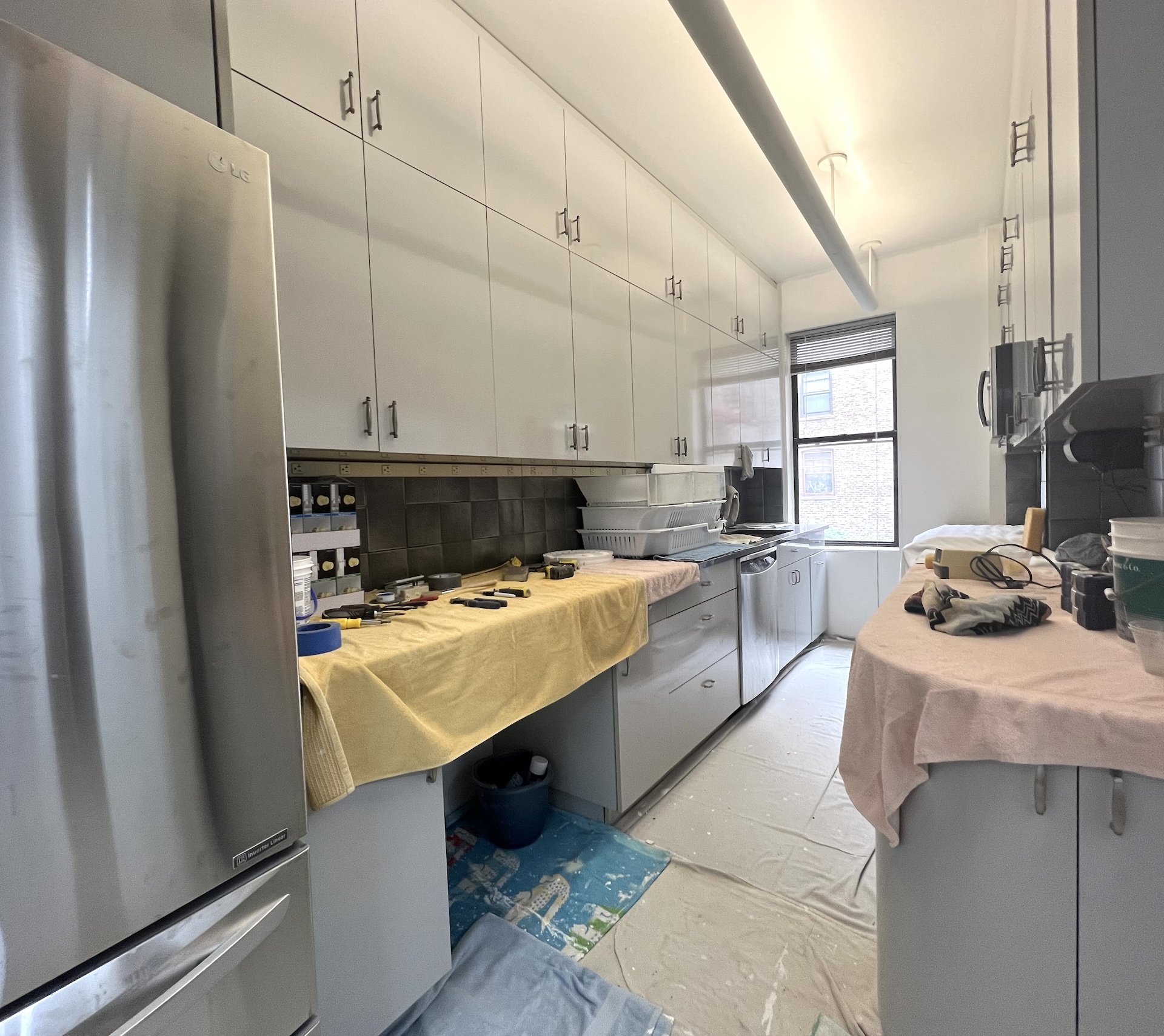 59 Livingston Street, Unit 3A Brooklyn, NY 11201 - Photo 4 of 19 a kitchen with stainless steel appliances a stove a sink and a refrigerator