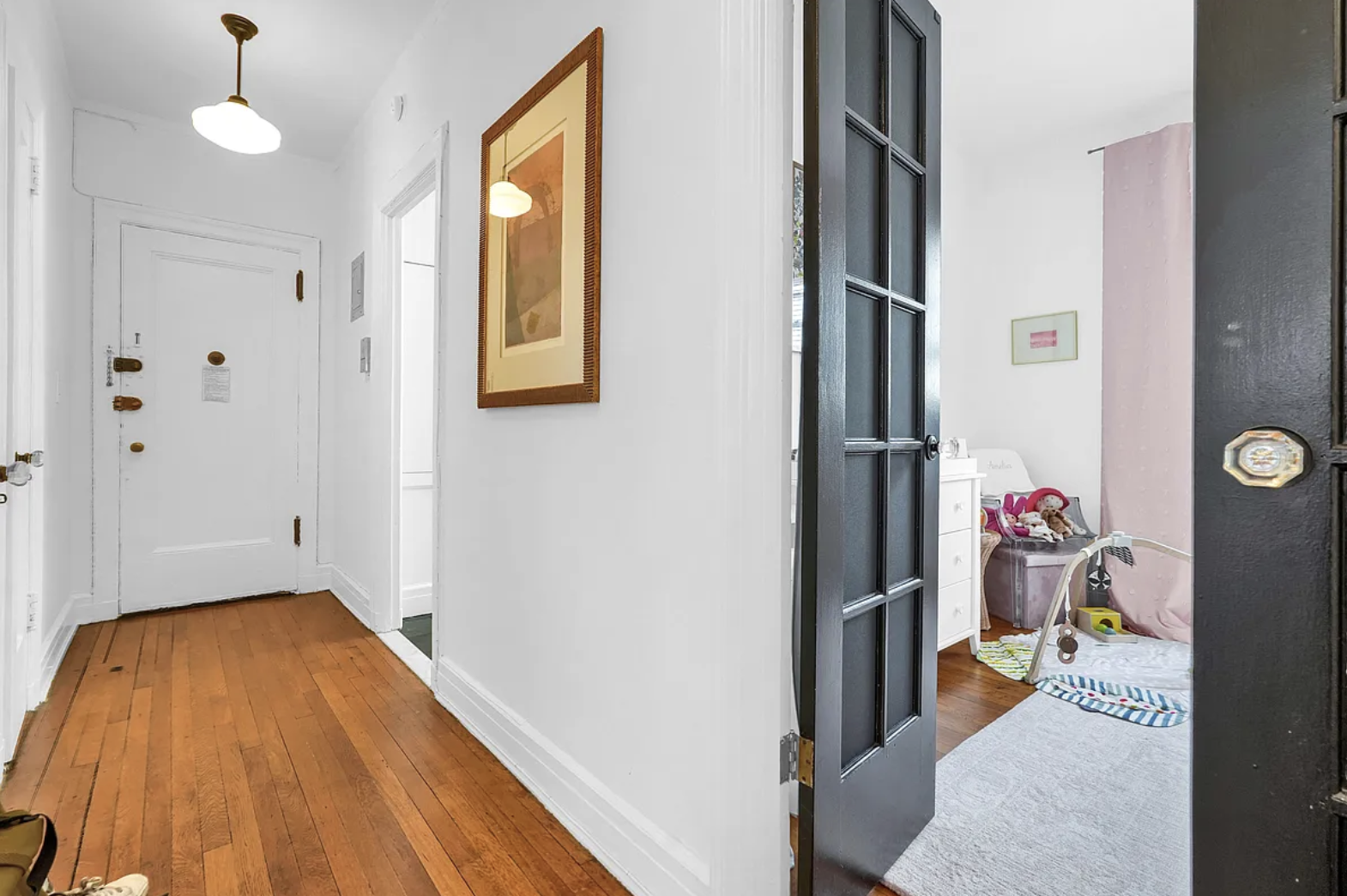 12 Clark Street, Unit 5B Brooklyn, NY 11201 - Photo 6 of 9 a view of hallway with livingroom and baby crib