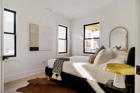 a bedroom with bed and a window