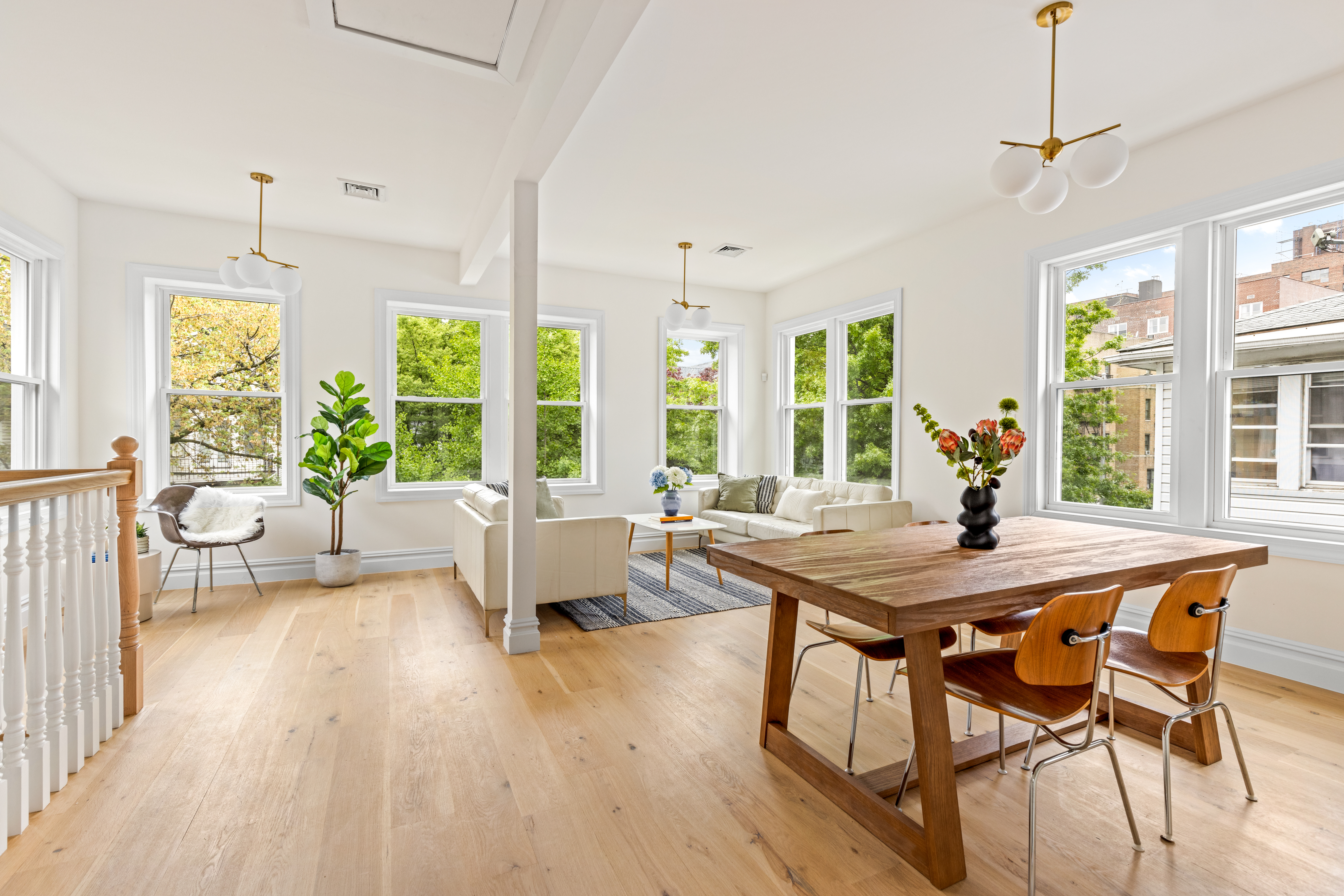 409 East 4th Street Brooklyn, NY 11218 - Photo 2 of 19 a view of a dining room with furniture large windows and wooden floor