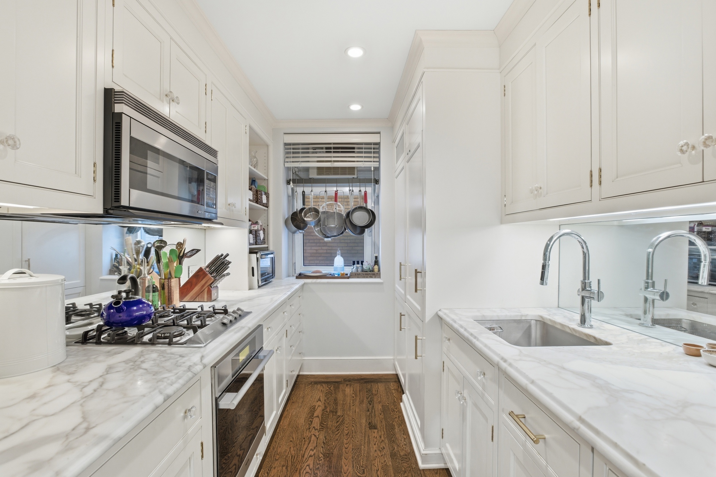 60 Gramercy Park North, Unit 8D Manhattan, NY 10010 - Photo 5 of 14 a kitchen with a sink stove and cabinets