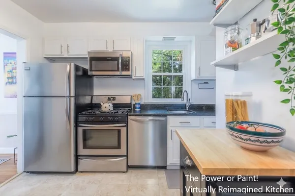 a kitchen with stainless steel appliances granite countertop a stove and a refrigerator