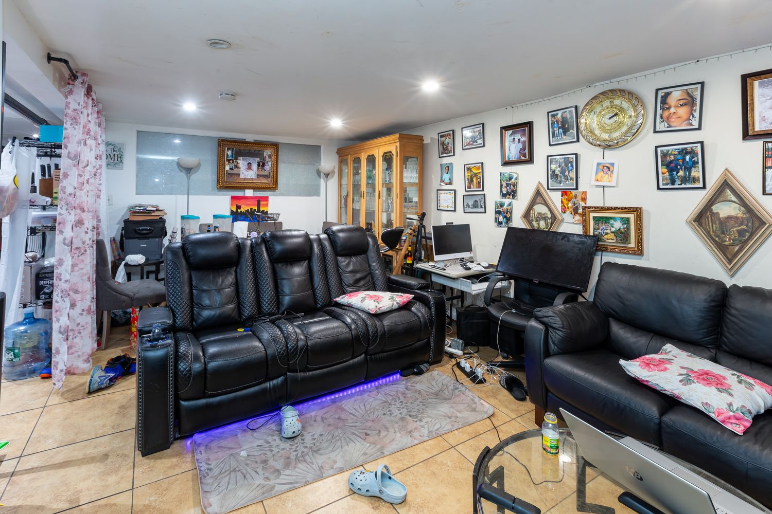 297 Pennsylvania Avenue Brooklyn, NY 11207 - Photo 2 of 9 a living room with furniture and a flat screen tv