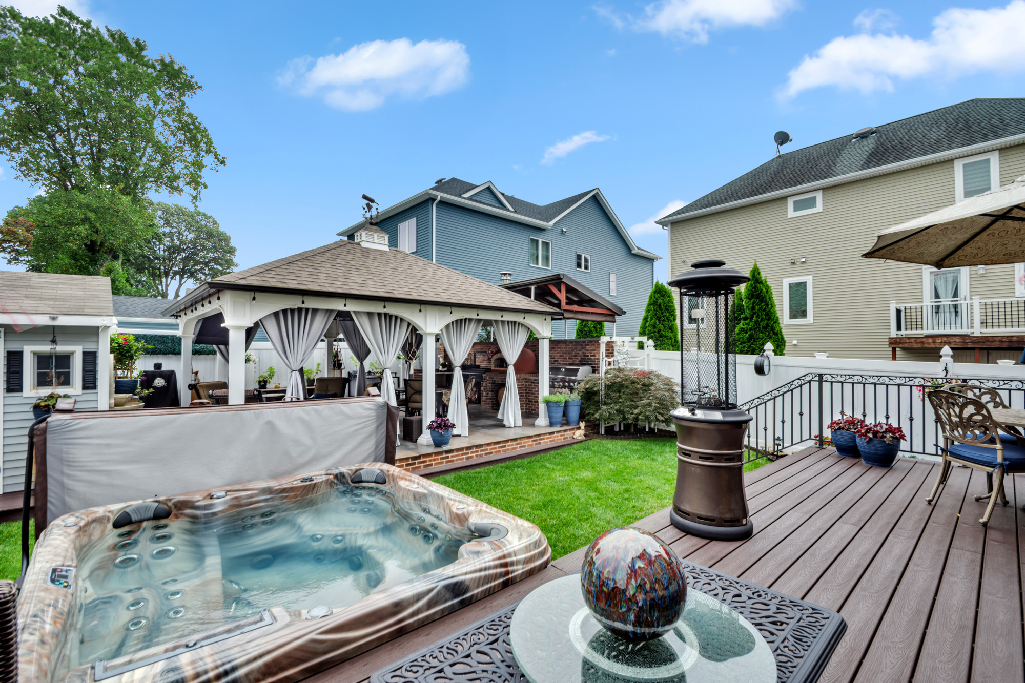 909 Jewett Avenue Staten Island, NY 10314 - Photo 46 of 65 a view of a house with backyard porch and sitting area