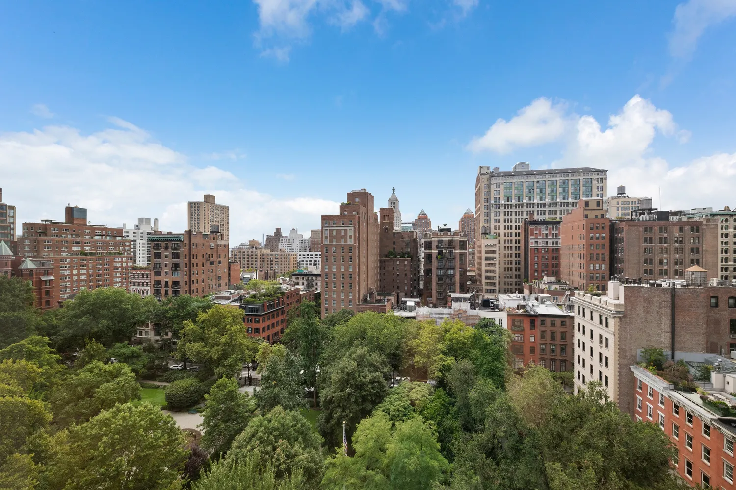 a view of a city with tall buildings