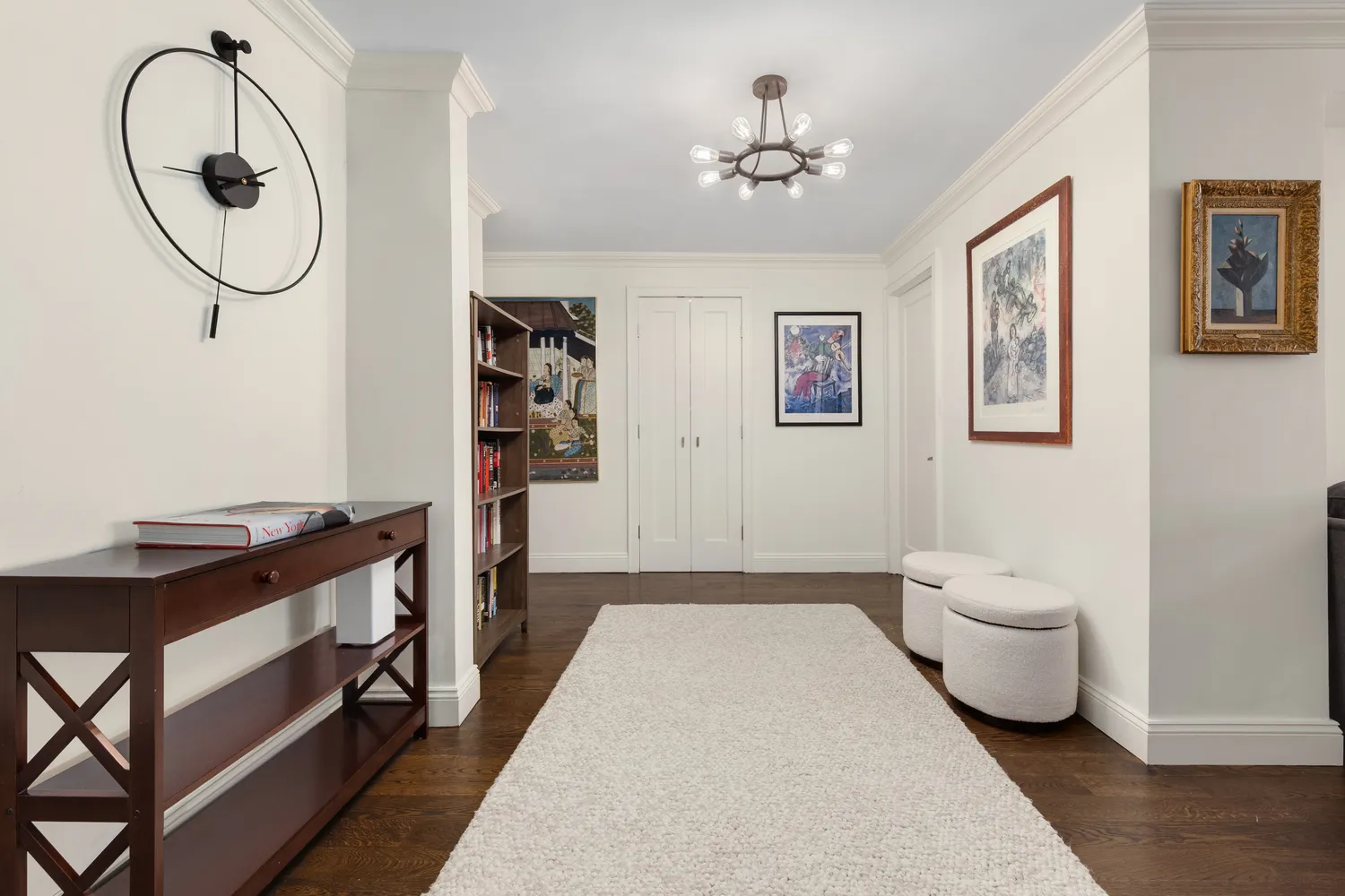 a spacious bedroom with a bed and a chandelier