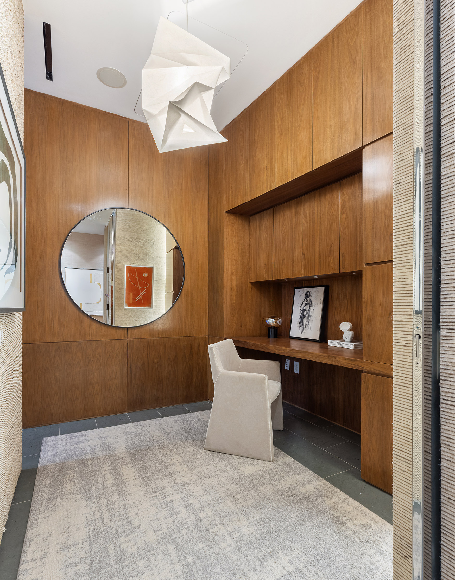 166 Perry Street, Unit 1C Manhattan, NY 10014 - Photo 6 of 18 a room with a chair and a fireplace