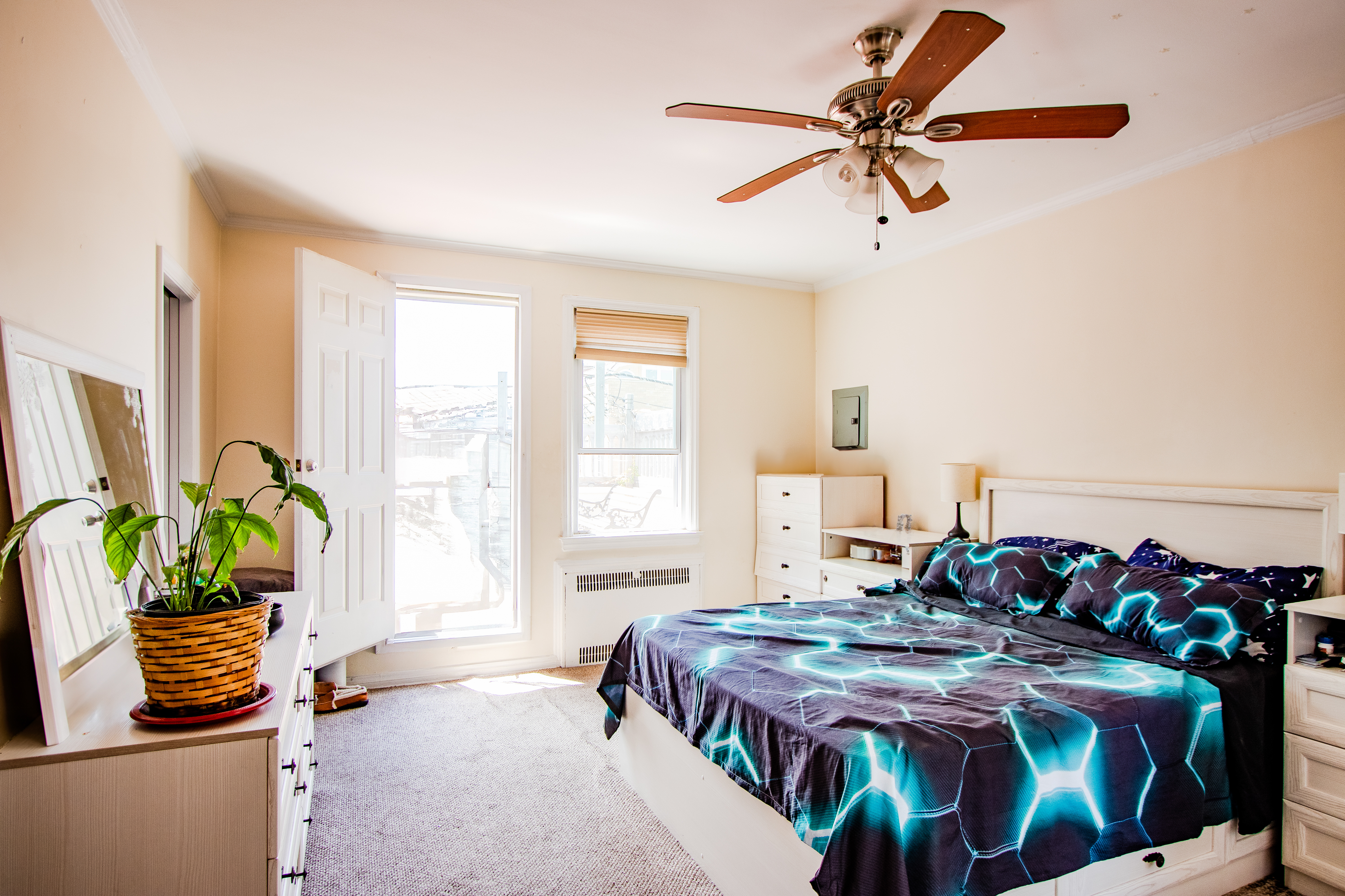 238 West End Avenue Brooklyn, NY 11235 - Photo 9 of 13 a bedroom with a bed and ceiling fan