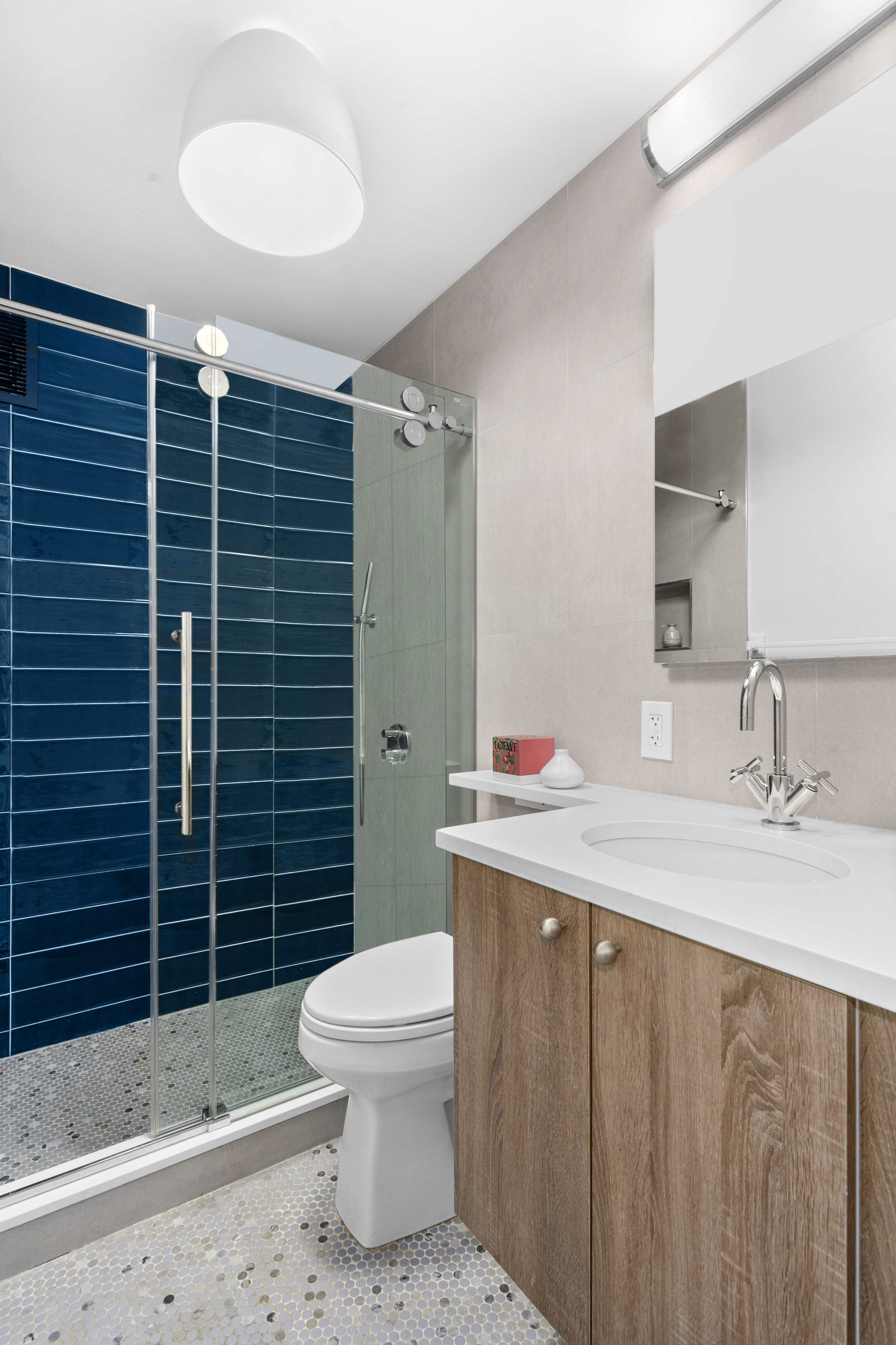 200 East 16th Street, Unit 5D Manhattan, NY 10003 - Photo 6 of 7 a bathroom with a toilet sink and shower