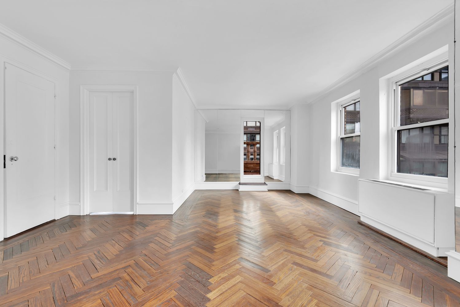 465 Park Avenue, Unit 26C Manhattan, NY 10022 - Photo 4 of 10 a view of empty room with windows
