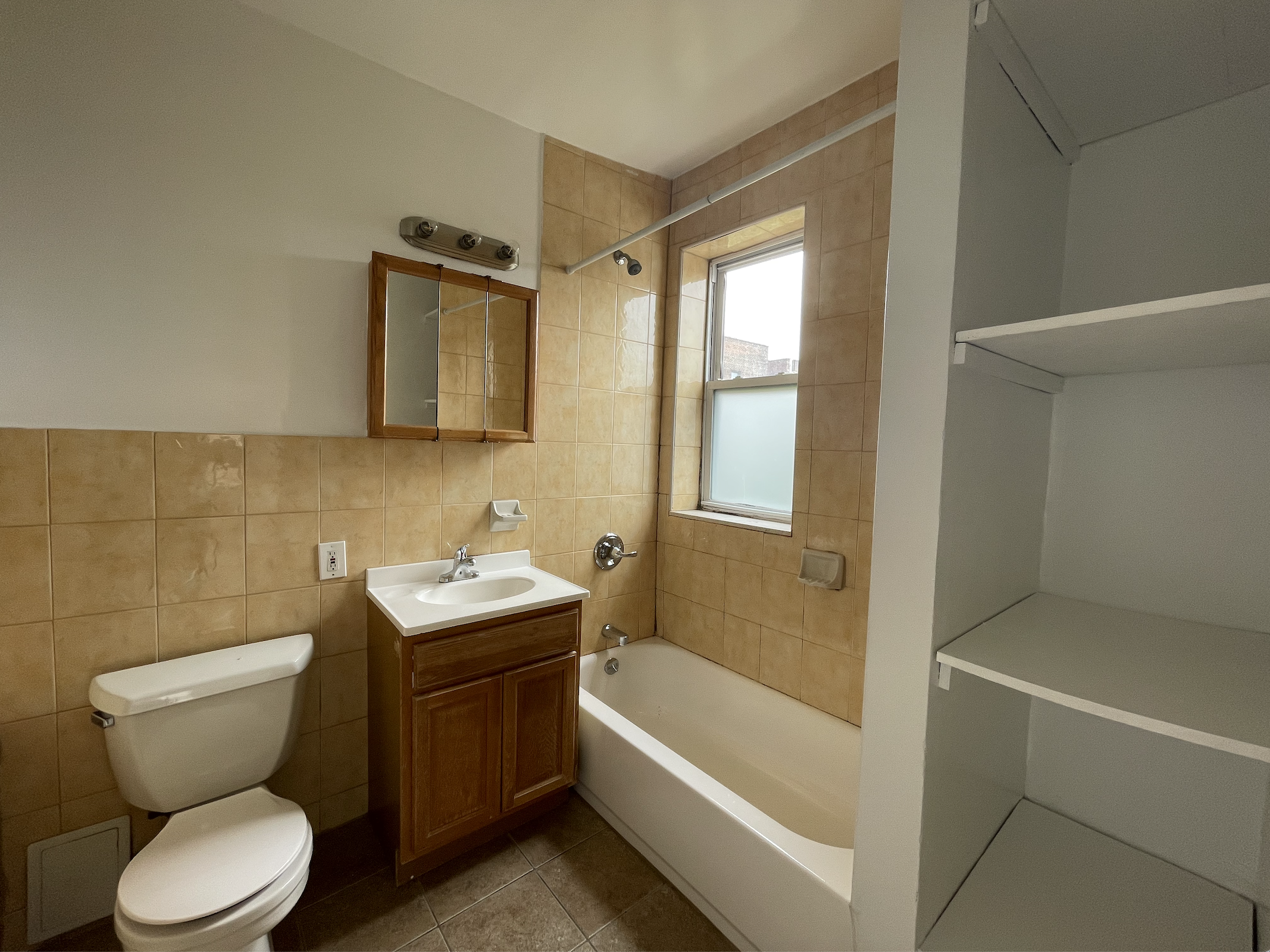 35-19 Broadway, Unit 3 Queens, NY 11106 - Photo 10 of 11 a bathroom with a sink toilet and shower