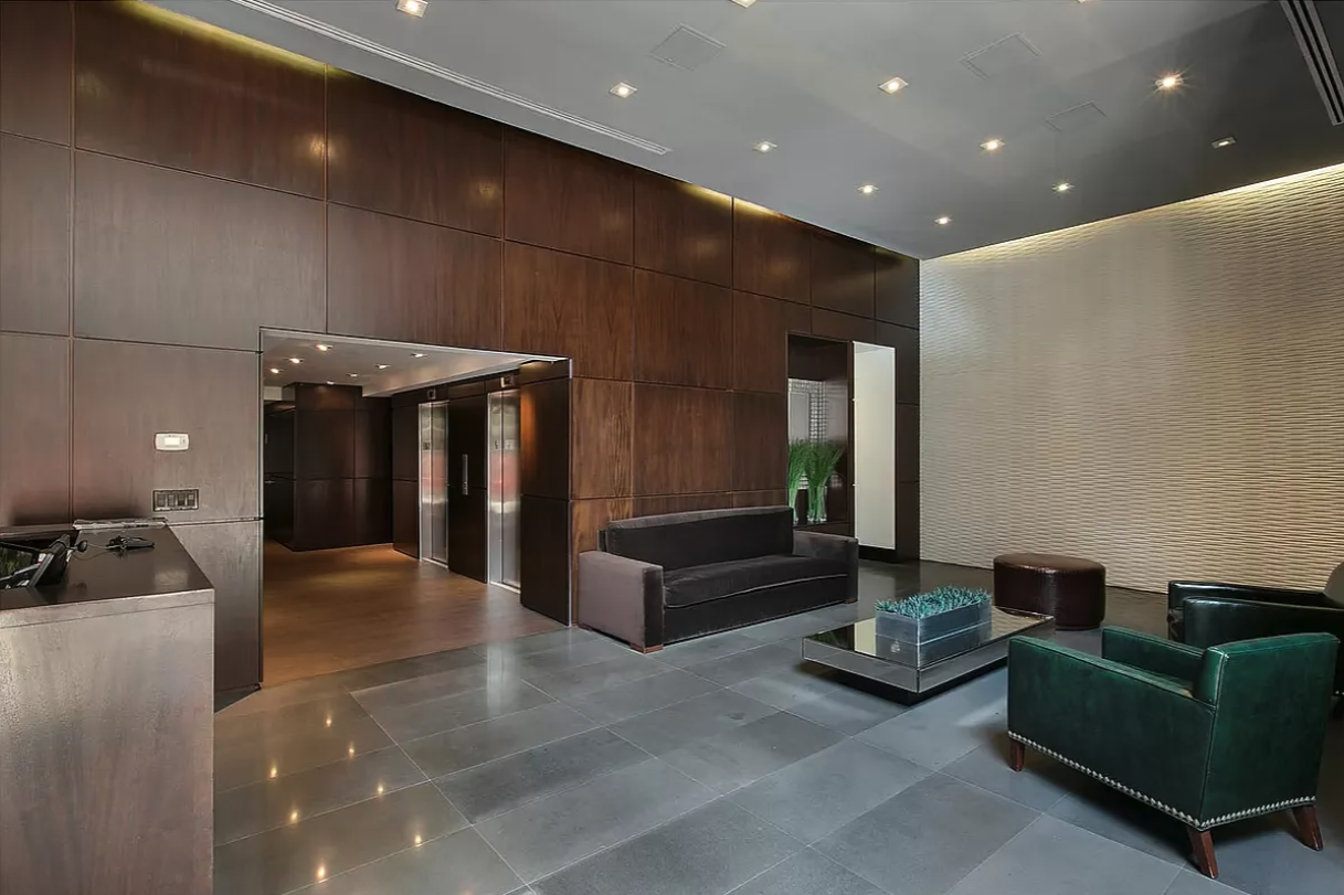 Park Ave S, Unit 7PR Manhattan, NY 10010 - Photo 11 of 15 a living room with furniture and a chandelier