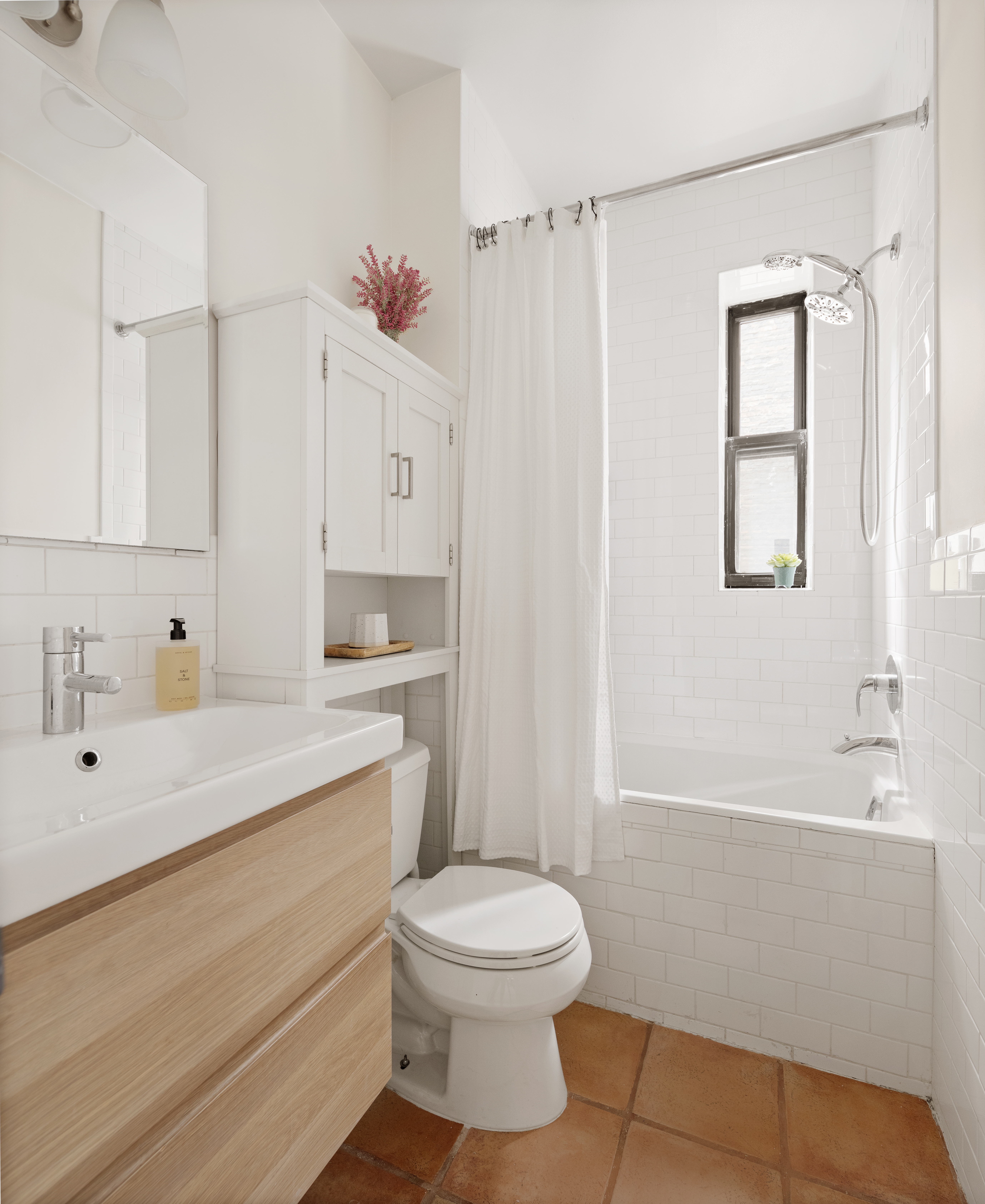 310 West 99th Street, Unit 308 Manhattan, NY 10025 - Photo 5 of 10 a bathroom with a sink a toilet and shower