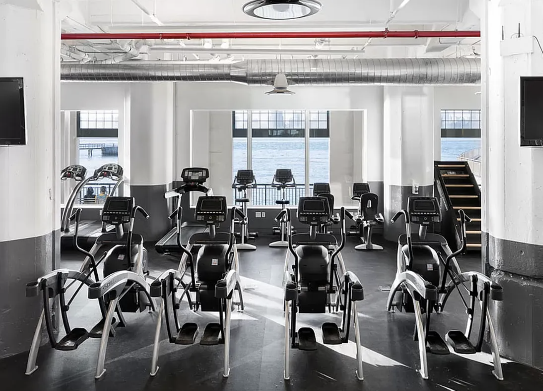 184 Kent Avenue, Unit D512 Brooklyn, NY 11249 - Photo 9 of 11 a gym with equipment window