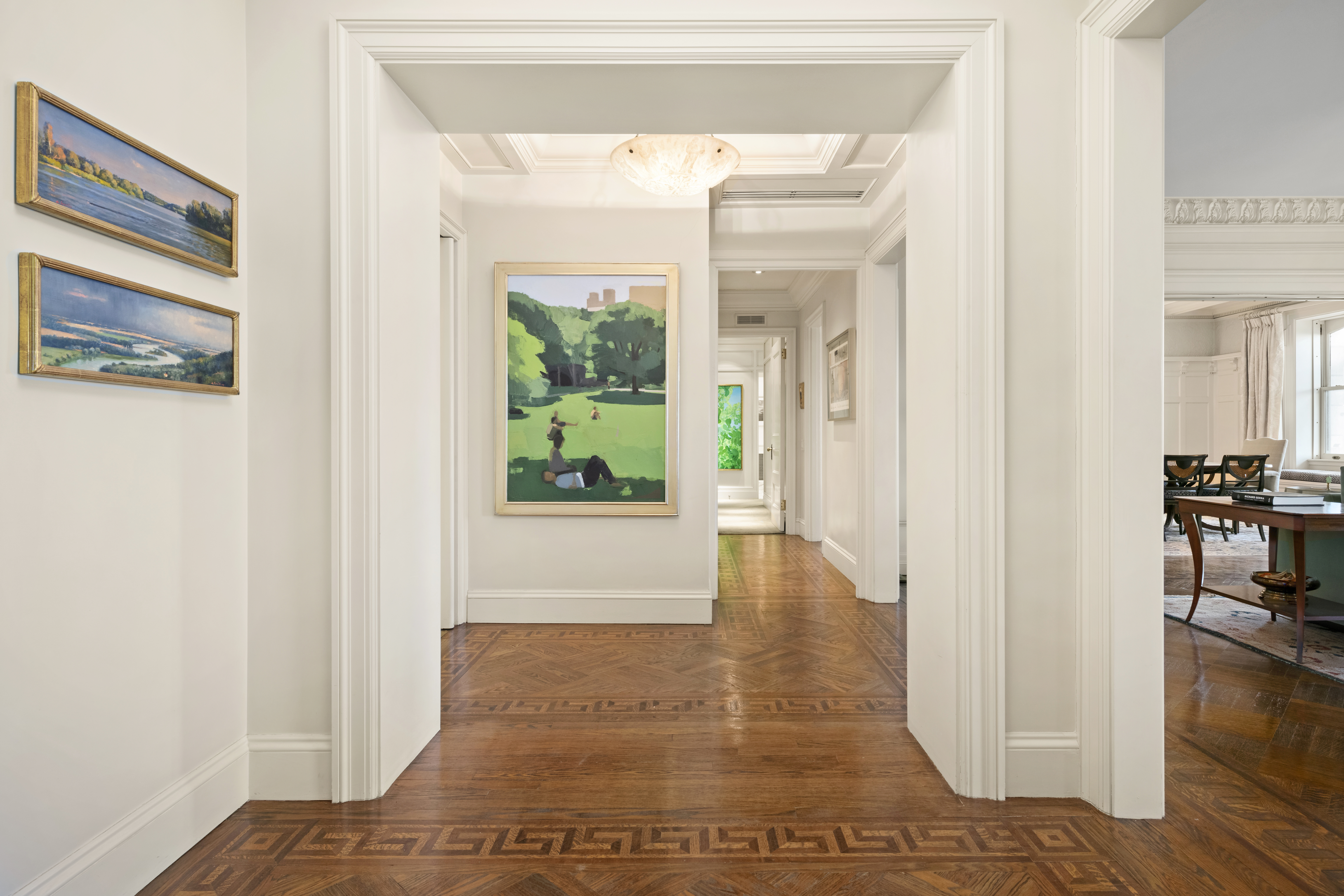 151 Central Park West, Unit 11NORTH Manhattan, NY 10023 - Photo 6 of 19 a view of a hallway with wooden floor and dining room