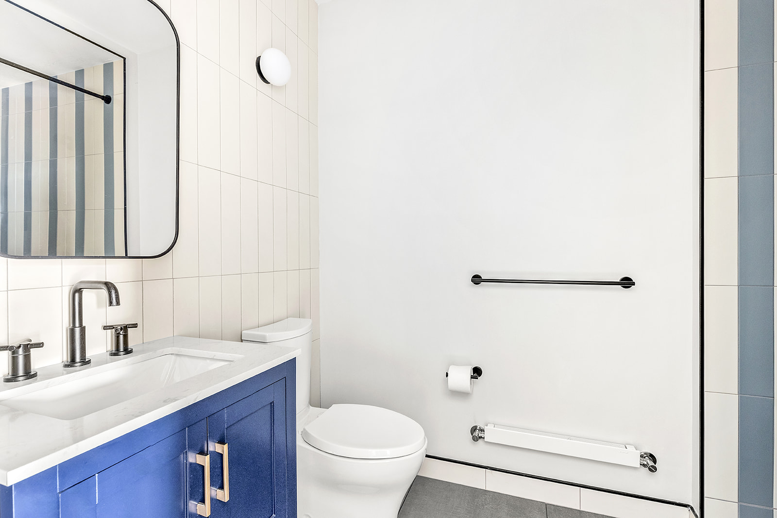 155 14th Street, Unit B Brooklyn, NY 11215 - Photo 3 of 6 a bathroom with a sink a toilet and shower