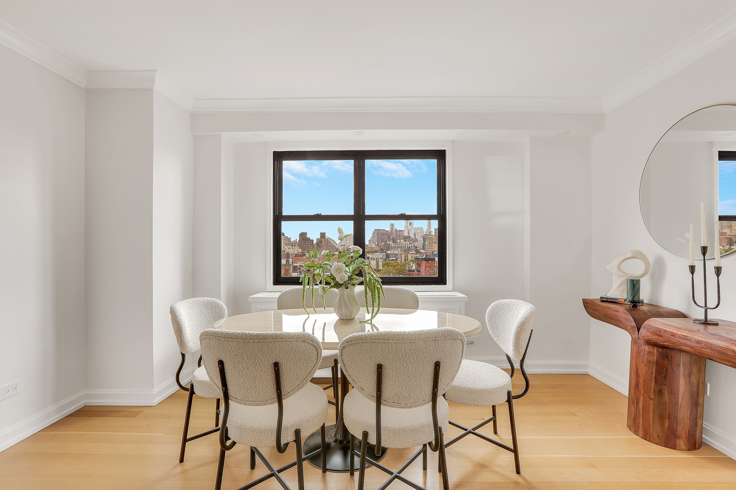 31 Jane Street, Unit 10FG Manhattan, NY 10014 - Photo 7 of 27 a view of a dining room with furniture and a window